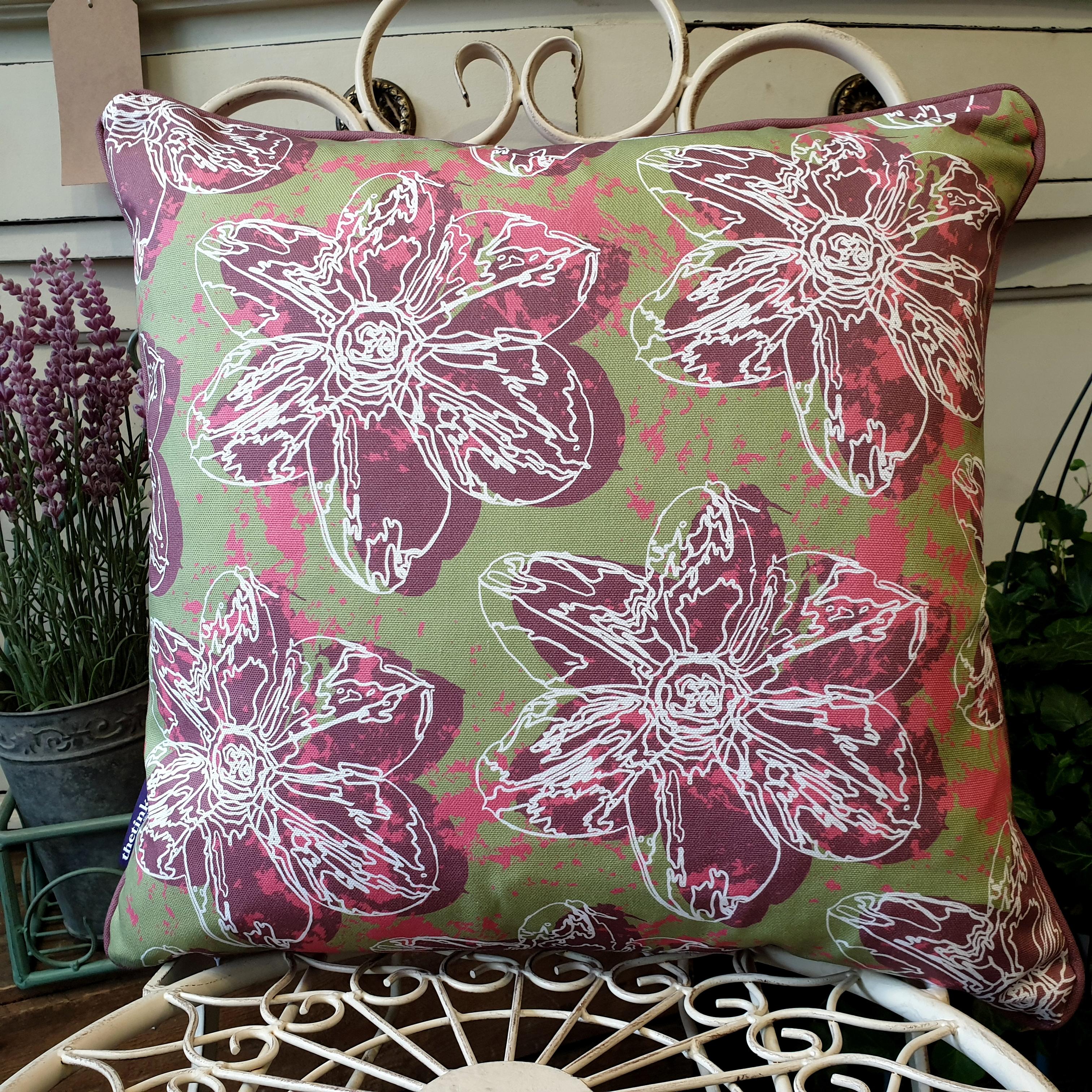 Double-sided 45cm square Flower Splash cushion designed by thetinkan. Dark red narcissus flower and dark red piping with white traced outline set within an olive green background with salmon pink paint splashes. Available with an optional luxury cushion inner pad. VIEW PRODUCT >>