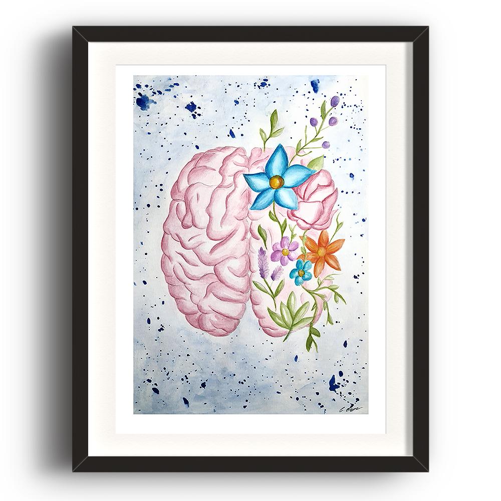 A watercolour print by Clarrie-Anne on eco fine art paper titled Mindfulness showing a brain with flowers surrounding it. The image is set in a black coloured picture frame.