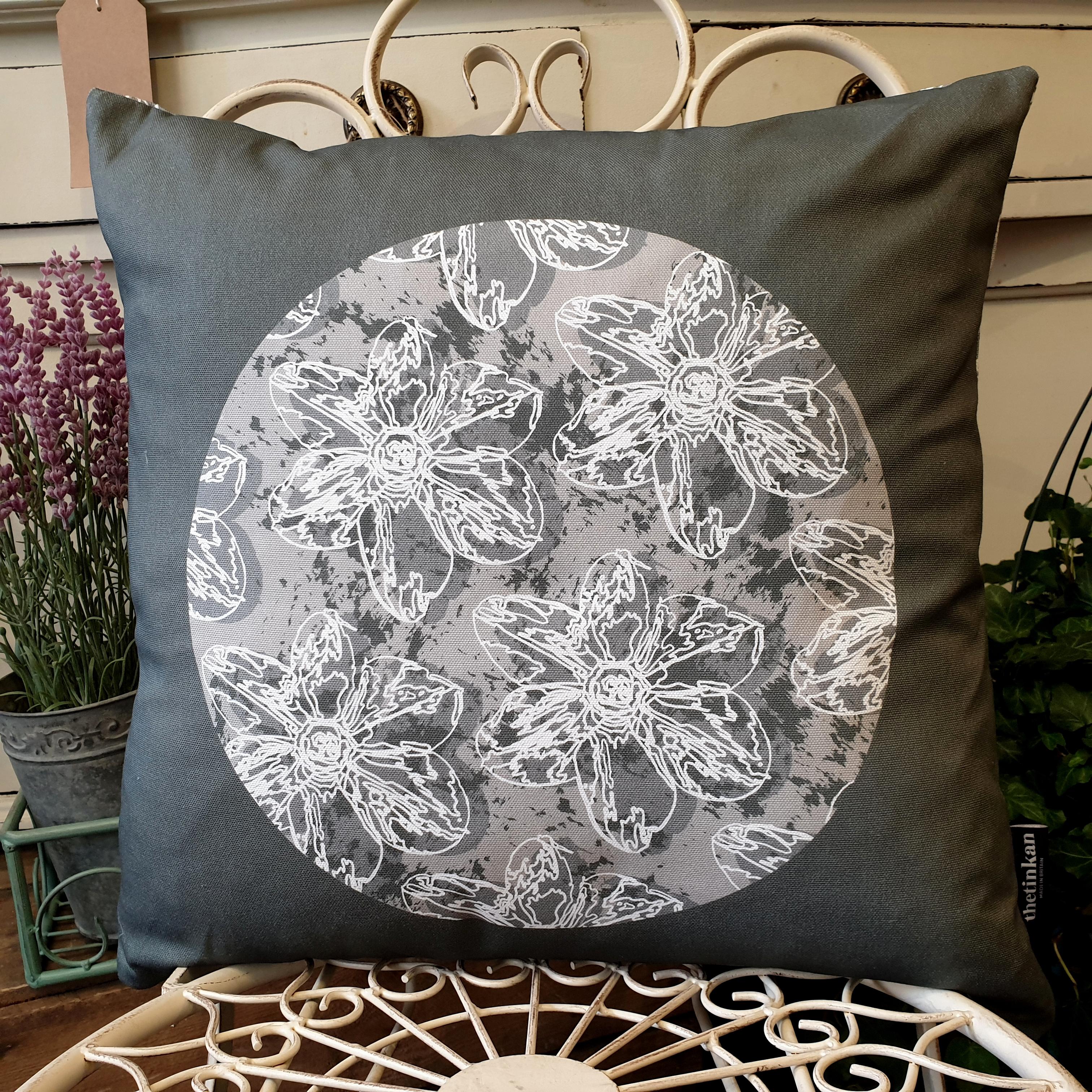 Double-sided 45cm square Flower Splash cushion designed by thetinkan. Grey narcissus flower with white traced outline set in a light grey coloured circle with charcoal grey paint splashes and charcoal grey surround. Available with an optional luxury cushion inner pad. VIEW PRODUCT >>