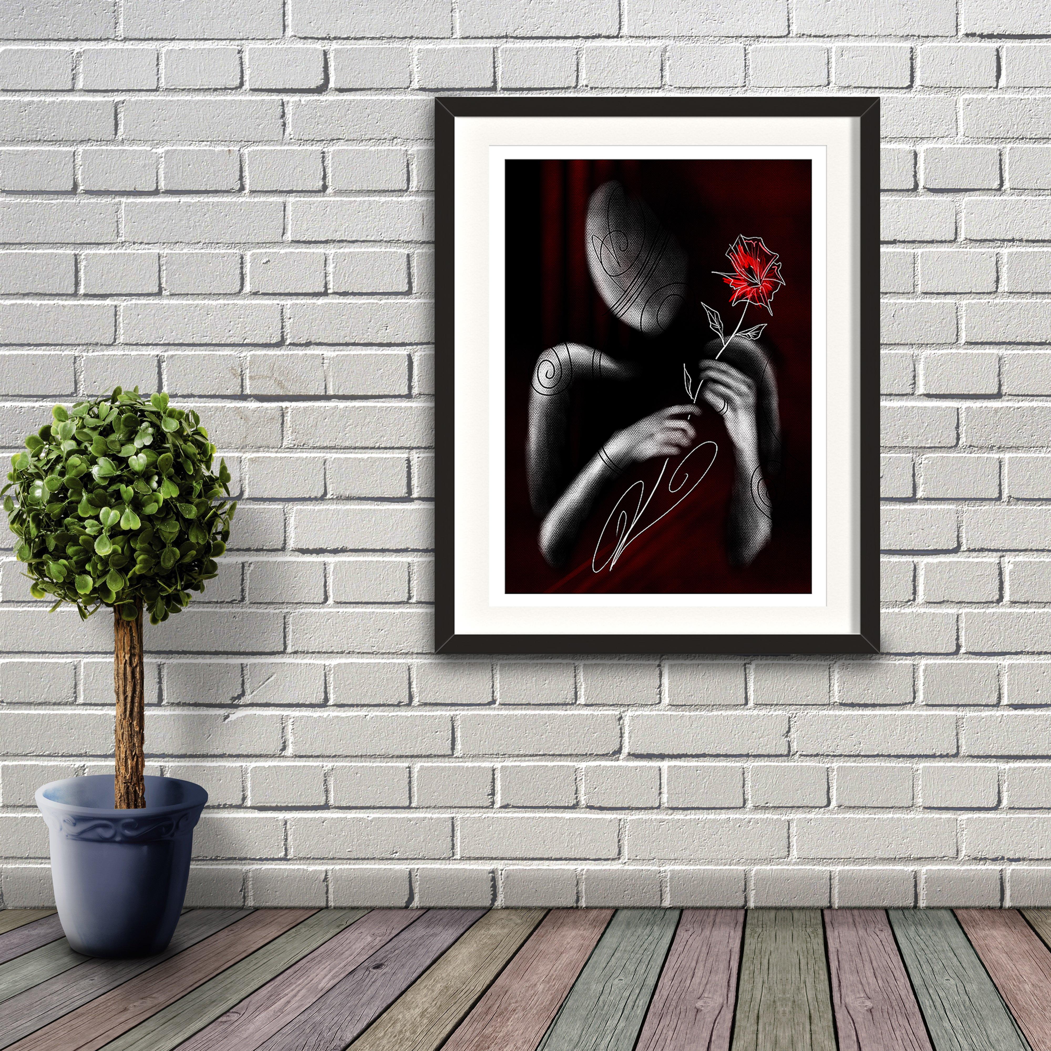 A greyscale digital painting by Lily Bourne shwing the minimalist outline of a figure presenting a red flower to viewer of the image. Artwork shown in a black frame hanging on a brick wall.