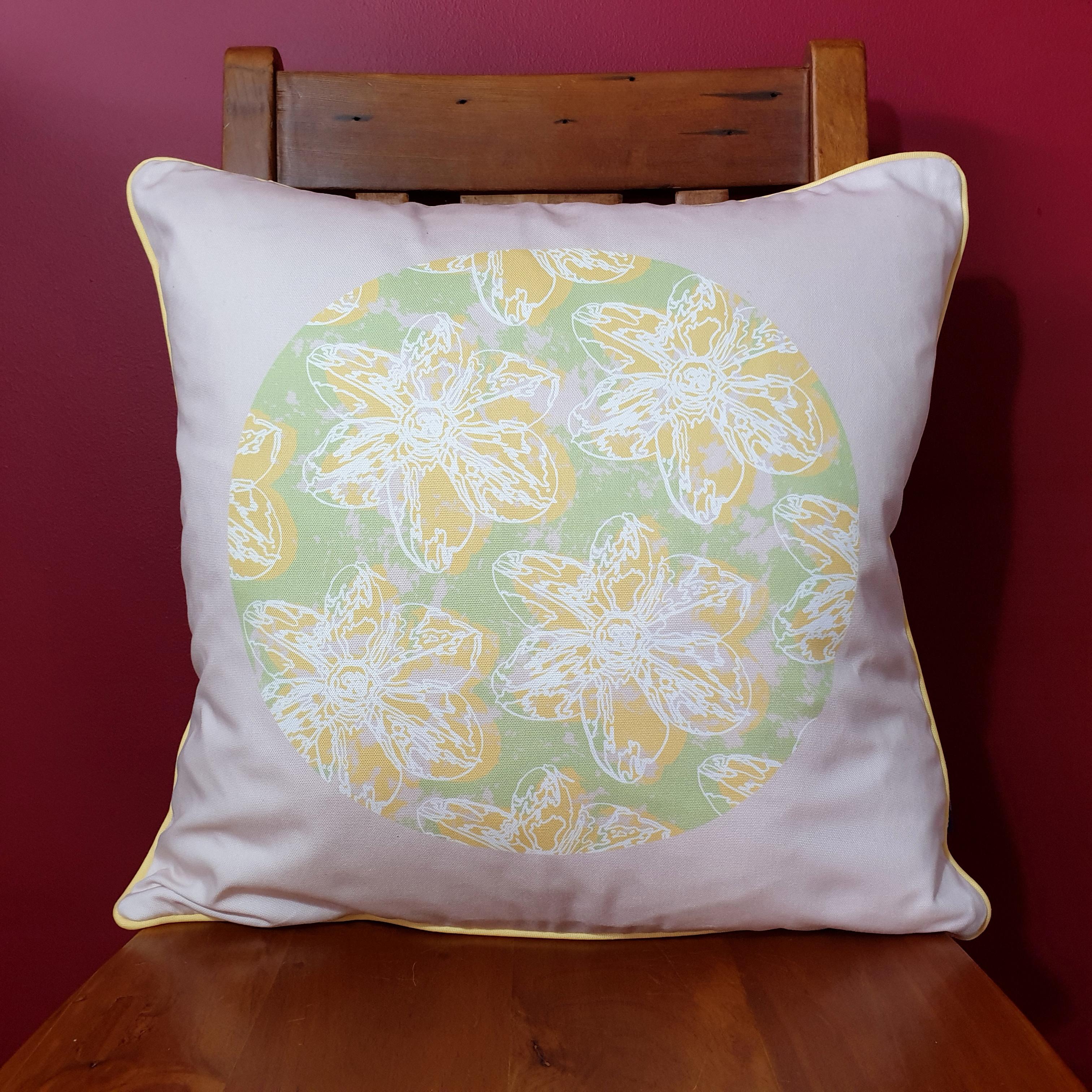 Double-sided 51cm square Flower Splash cushion designed by thetinkan. Yellow narcissus flower with white traced outline and yellow piping set in a mint green coloured circle with pale pink paint splashes and pale pink surround. Available with an optional luxury cushion inner pad. VIEW PRODUCT >>