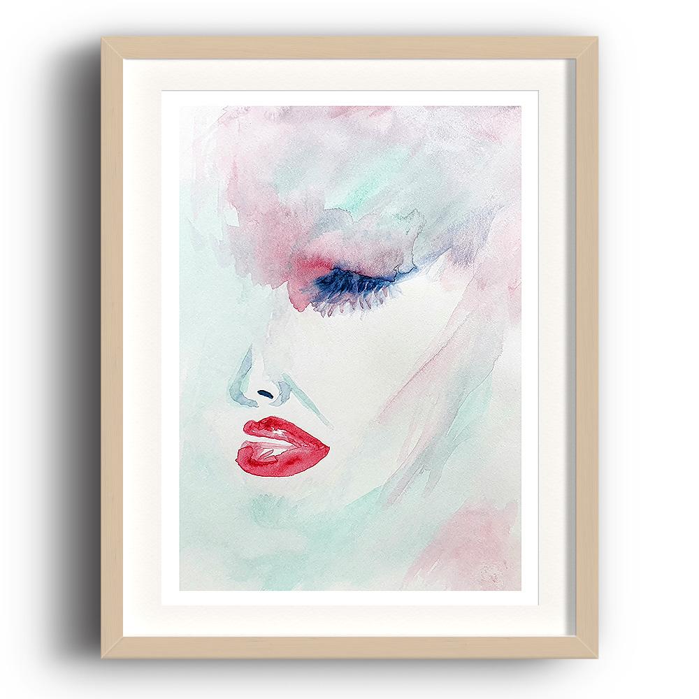 A watercolour print by Clarrie-Anne on eco fine art paper titled Wistful showing the side of a female face in red, green and blue with a wash backgorund. The image is set in a beech coloured picture frame.