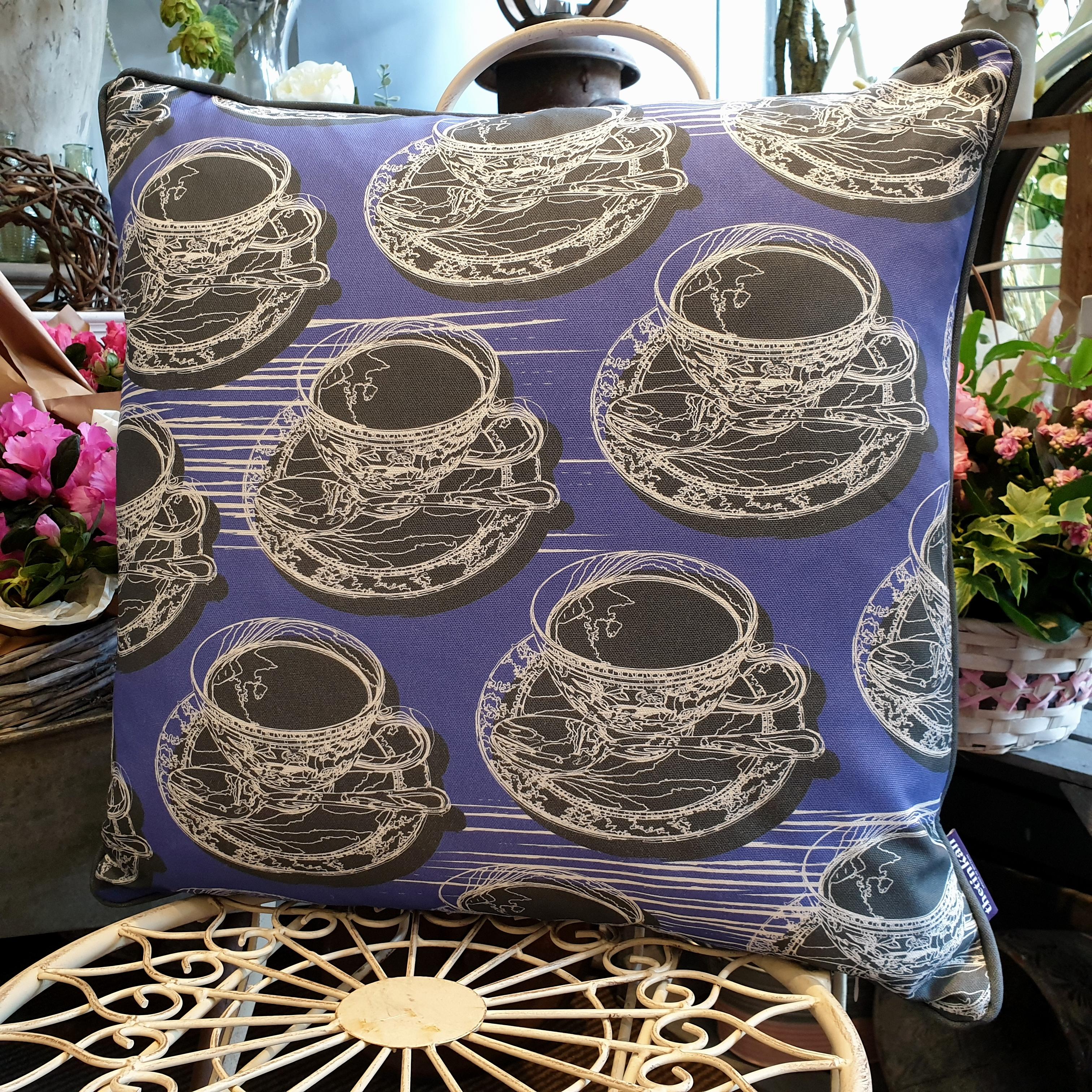 Double-sided violet purple 51cm square retro Afternoon Tea cushion with artistic white shards and grey handcrafted piping designed by thetinkan. White traced outline of multiple British teacups and saucers each colour filled in charcoal grey. Available with an optional luxury cushion inner pad. VIEW PRODUCT >>