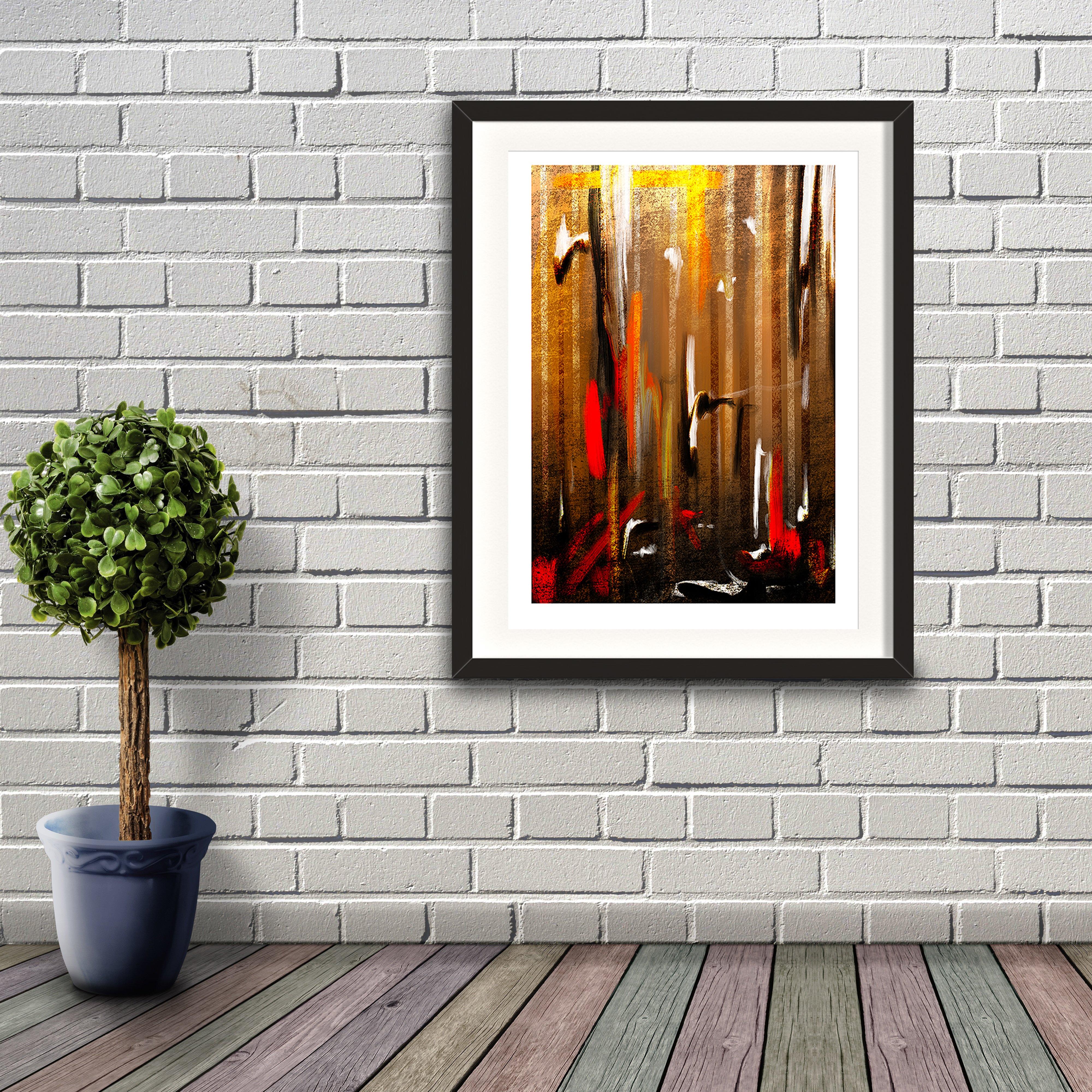 An abstract digital painting by Lily Bourne printed on eco fine art paper titled Autumnal Burst showing orange, red, white and black downward strokes portraying trees with the colours of autumn. Artwork is shown in a black frame hanging on a brick wall.