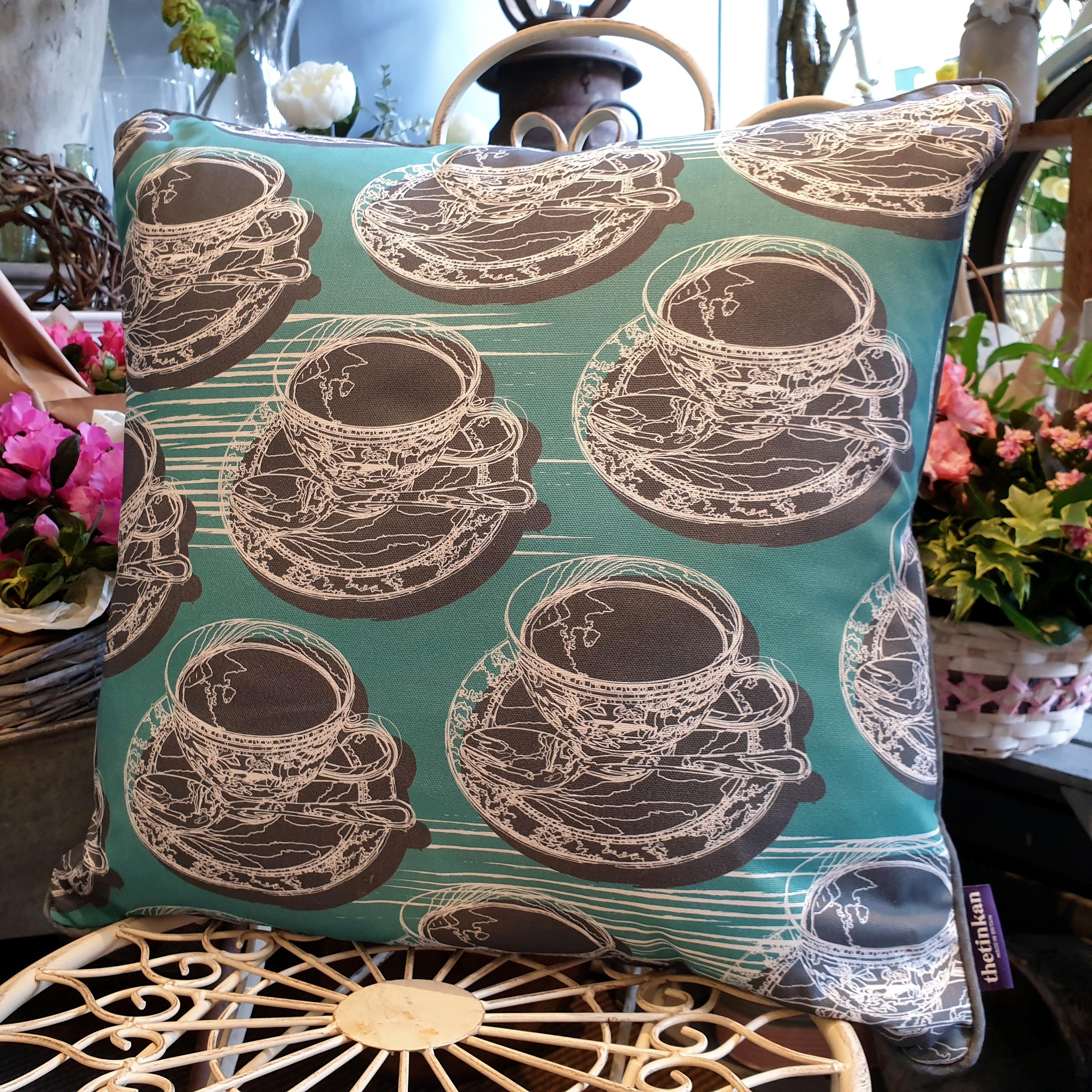 Double-sided aqua teal 51cm square retro Afternoon Tea cushion with artistic white shards and grey handcrafted piping designed by thetinkan. White traced outline of multiple British teacups and saucers each colour filled in charcoal grey. Available with an optional luxury cushion inner pad. VIEW PRODUCT >>