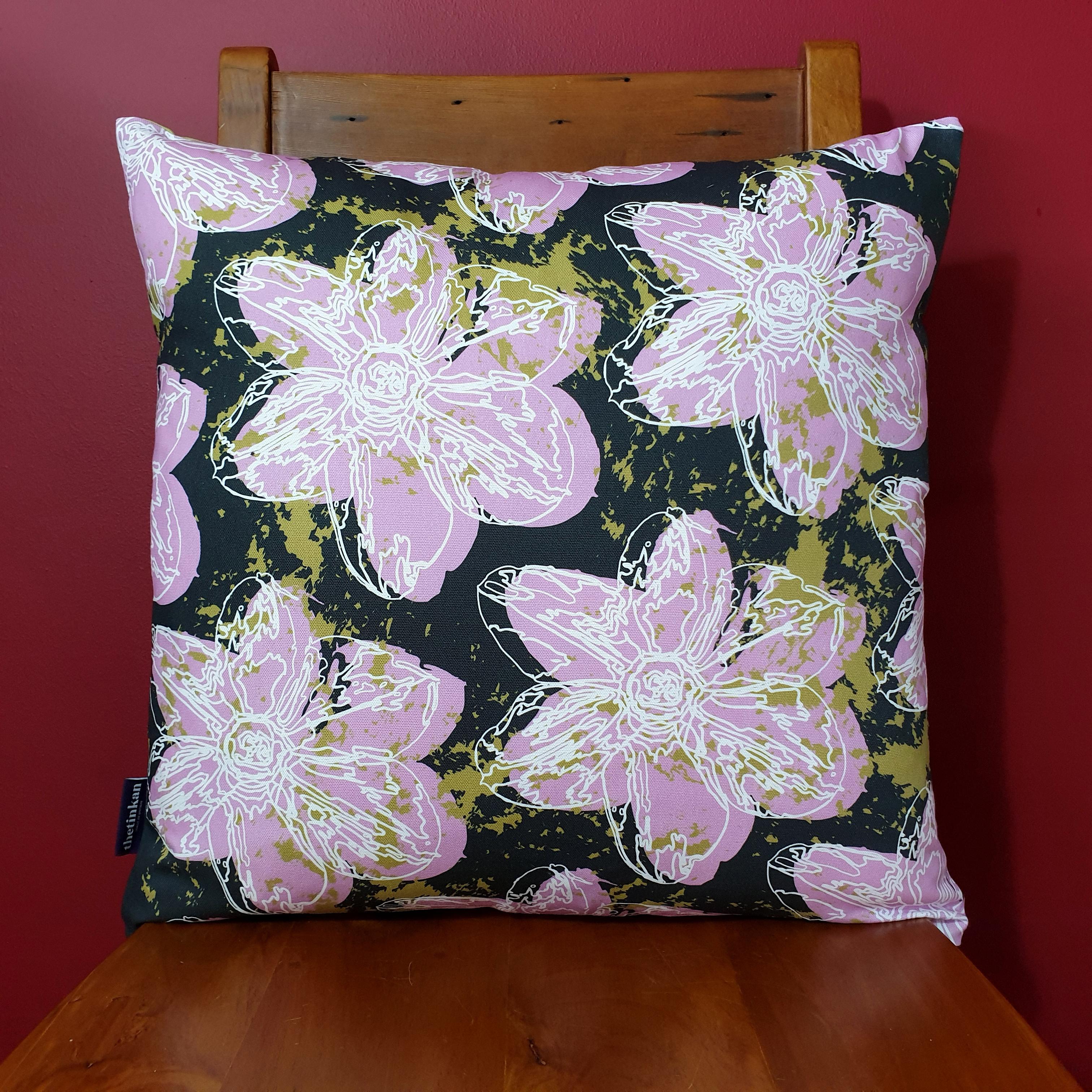 Double-sided 51cm square Flower Splash cushion designed by thetinkan. Candy pink narcissus flower with white traced outline set within a dark charcoal grey background with olive green paint splashes. Available with an optional luxury cushion inner pad. VIEW PRODUCT >>