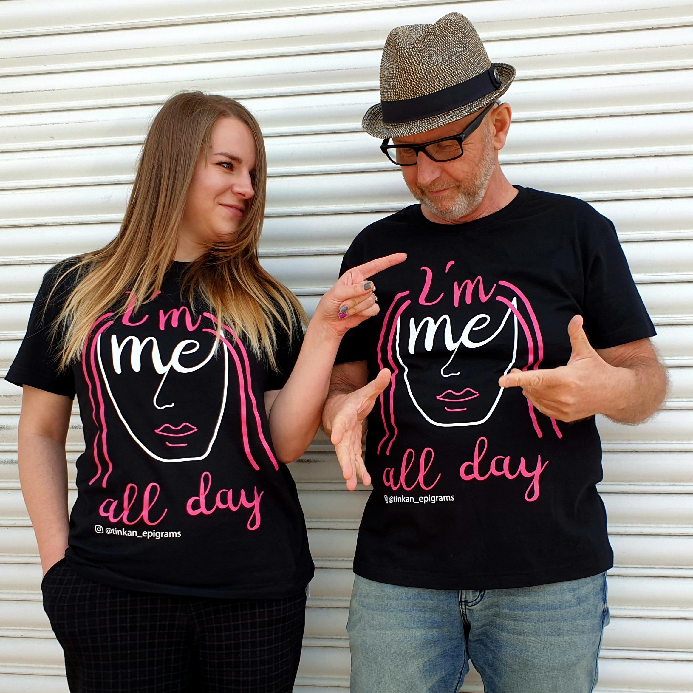 Adult female and male wearing black t-shirt with white handdrawn face with pink hair with the words I'm Me All Day printed. Designed by thetinkan. VIEW PRODUCT >>