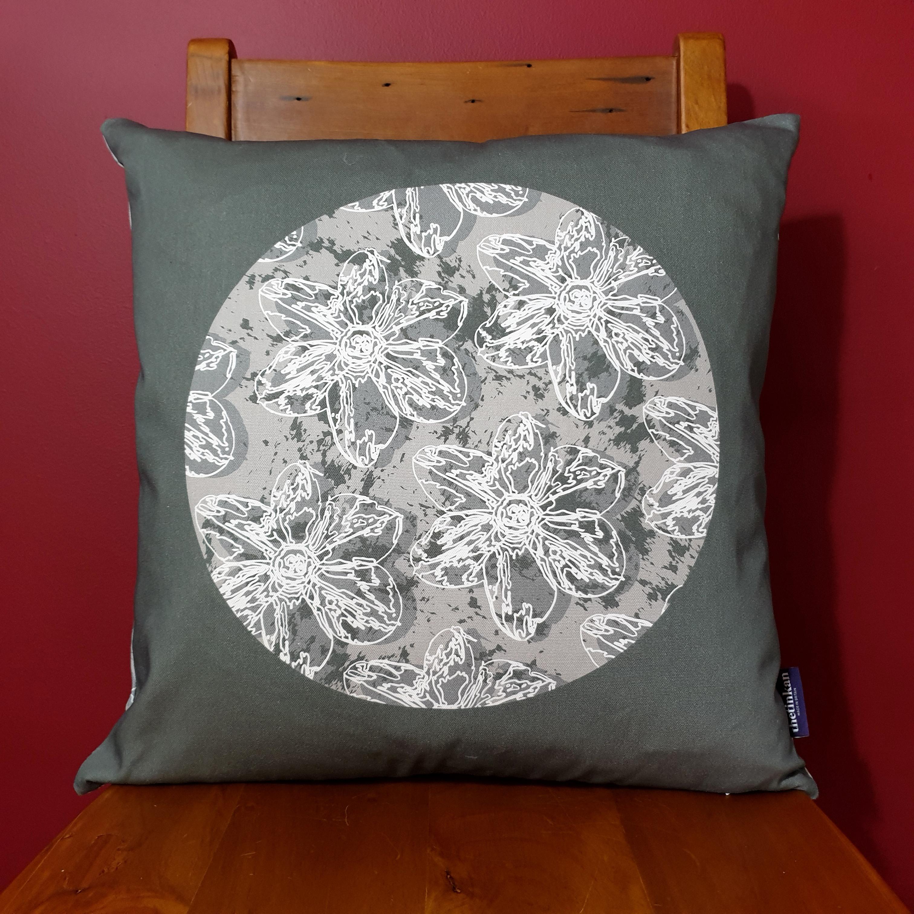 Double-sided 51cm square Flower Splash cushion designed by thetinkan. Grey narcissus flower with white traced outline set in a light grey coloured circle with charcoal grey paint splashes and charcoal grey surround. Available with an optional luxury cushion inner pad. VIEW PRODUCT >>