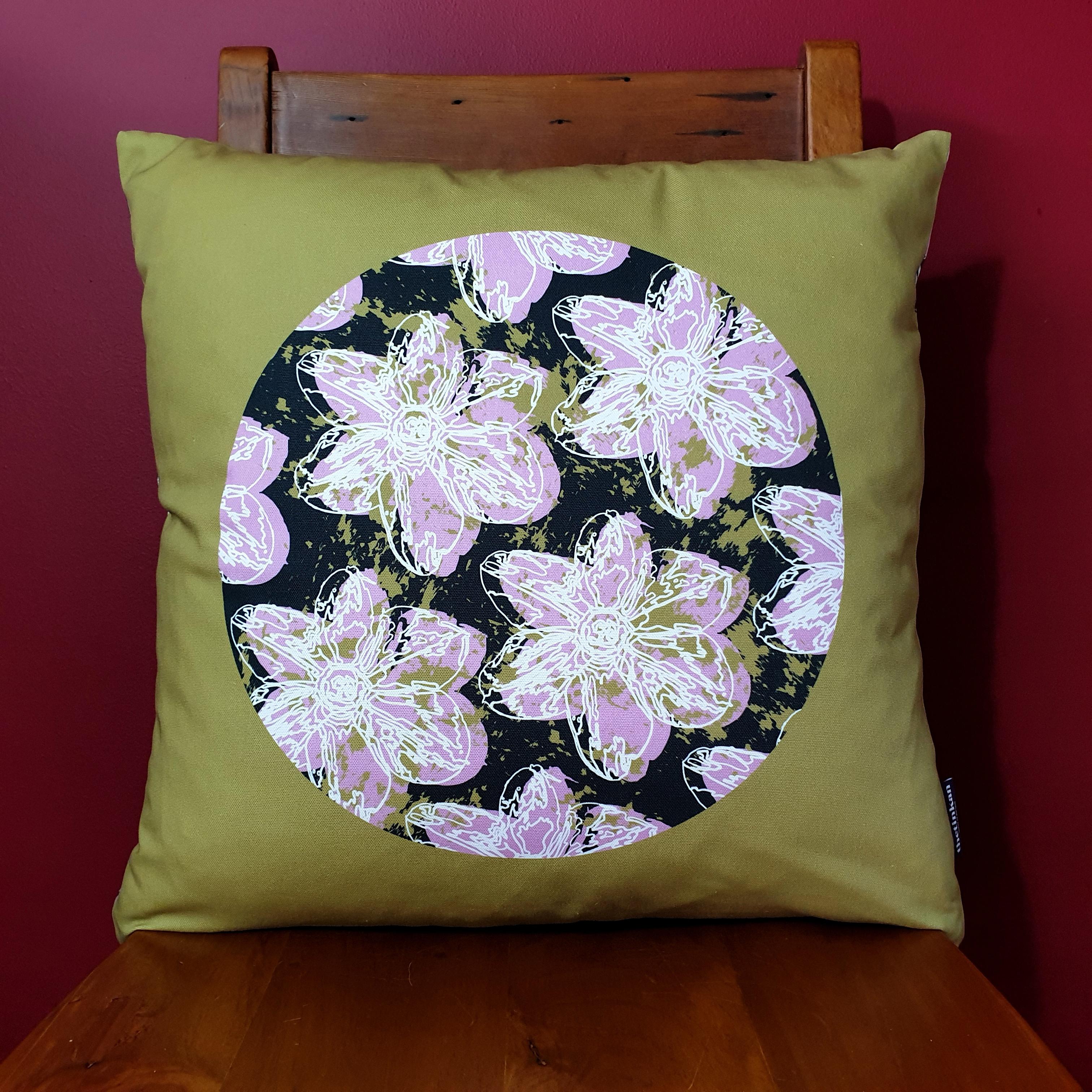 Double-sided 51cm square Flower Splash cushion designed by thetinkan. Candy pink narcissus flower with white traced outline set in a dark charcoal grey coloured circle with olive paint splashes and olive green surround. Available with an optional luxury cushion inner pad. VIEW PRODUCT >>