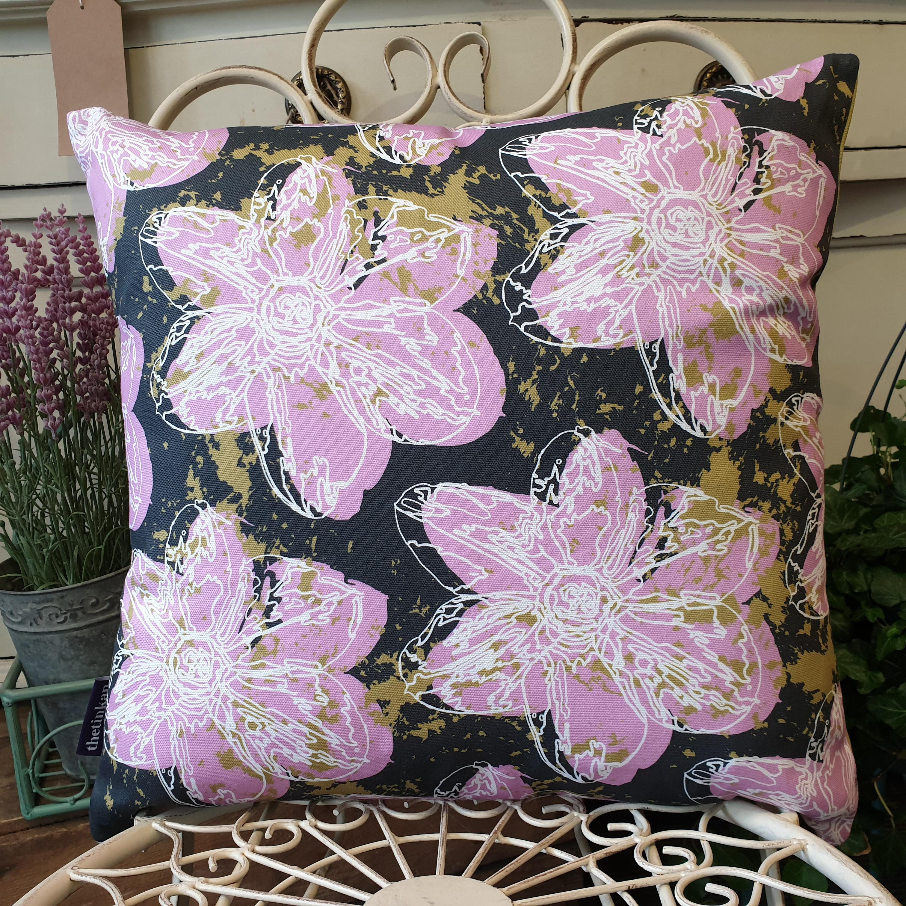 Double-sided 45cm square Flower Splash cushion designed by thetinkan. Candy pink narcissus flower with white traced outline set within a dark charcoal grey background with olive green paint splashes. Available with an optional luxury cushion inner pad. VIEW PRODUCT >>