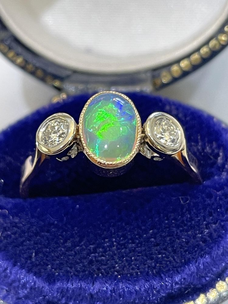Opal and diamond ring