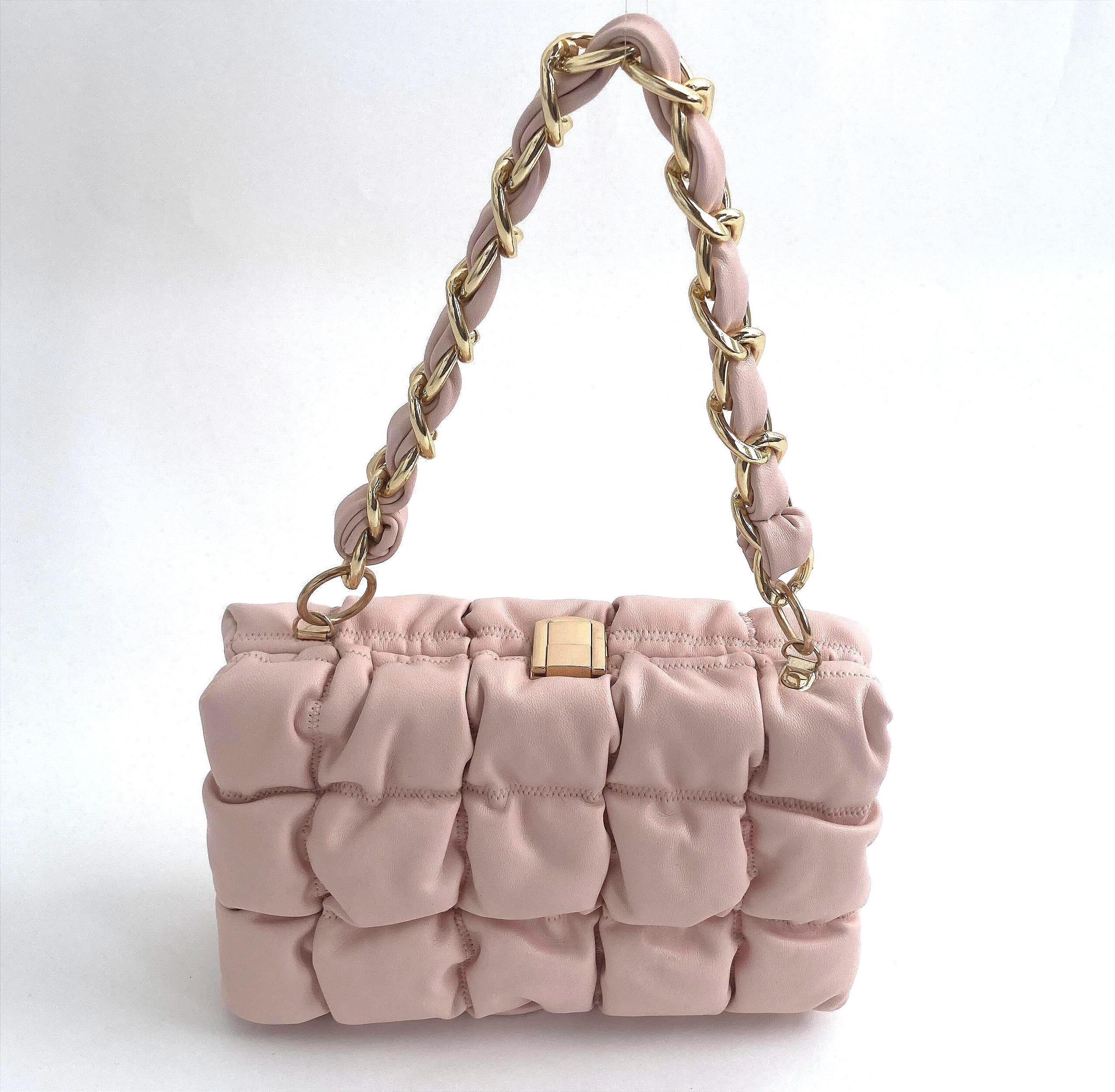 handle up of the clutch bag in pink