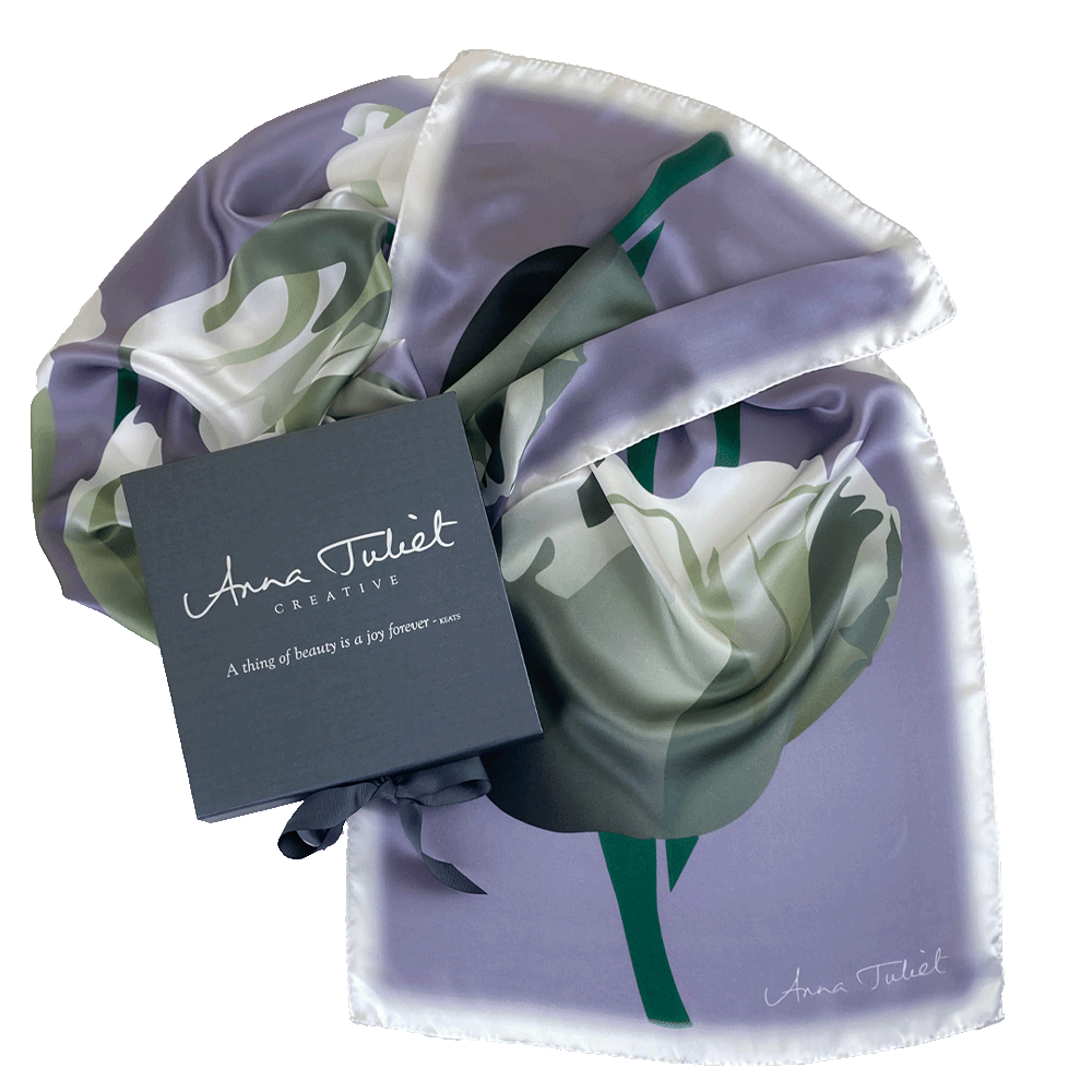 Floral pure silk scarf draped around a branded pewter-coloured gift box. Limited edition White Tulip on Dove Grey by Anna Juliet Creative.