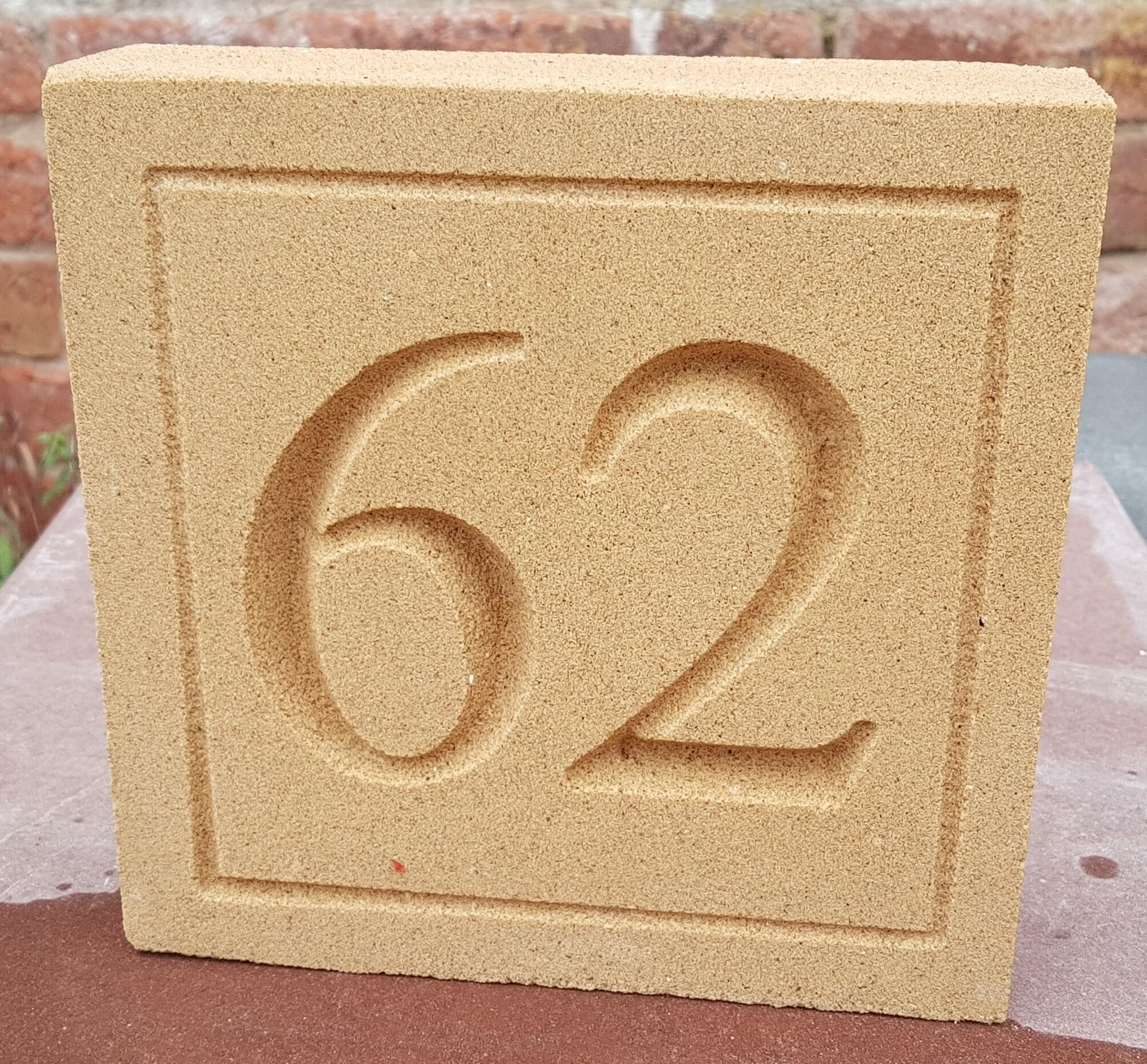 Deeply engraved stone house signs and dates stones in different sizes