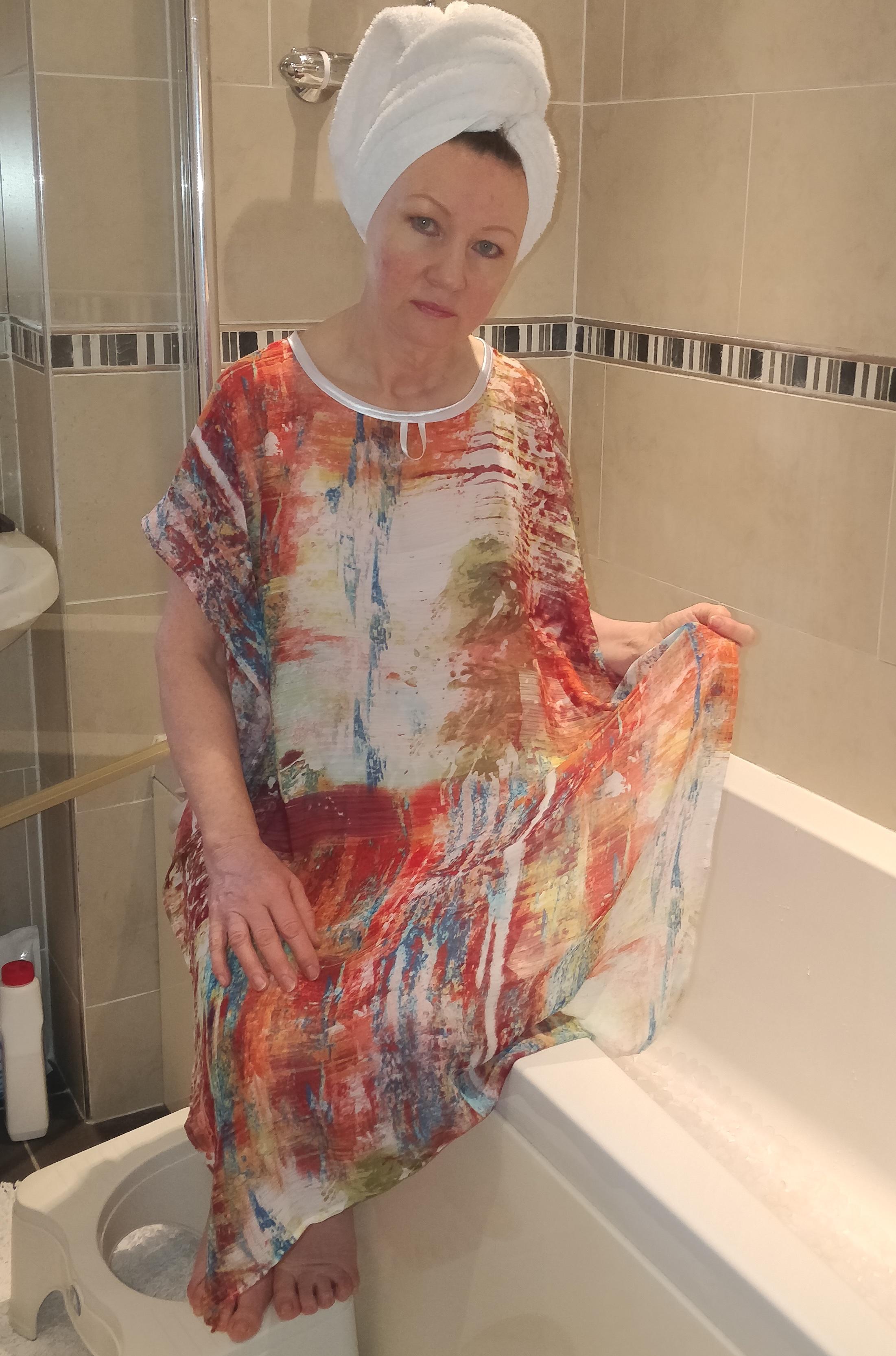 Tan/Turquoise multi NeverNaked(tm) Shower Drapron® to provide modesty, dignity and privacy whilst being helped to shower or bathe. Shower modesty wear. Bathing modesty gown. Lightweight crepe chiffon. Slips over shoulders - No sleeves Magnetic fastening at back