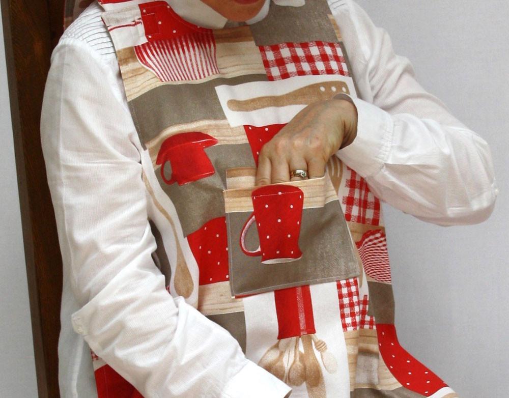 Showing pocket on red baking utensils patter dining drApron®. Protects clothing from spills and is much more dignified and attractive than an adult bib.