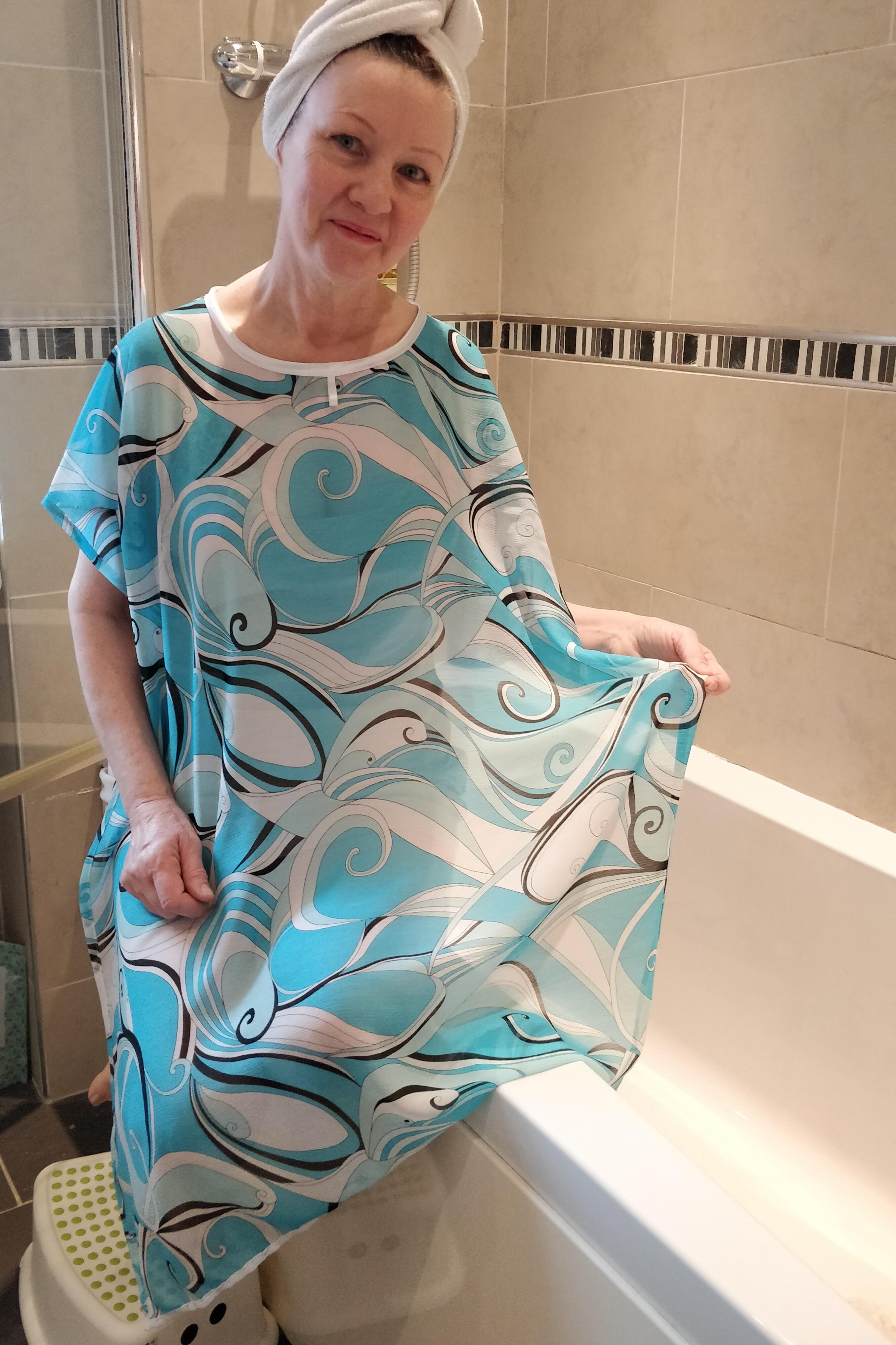 Turquoise Swirl NeverNaked(tm) Shower Drapron® to provide modesty, dignity and privacy whilst being helped to shower or bathe. Shower modesty wear. Bathing modesty gown. Lightweight crepe chiffon. Slips over shoulders - No sleeves Magnetic fastening at back