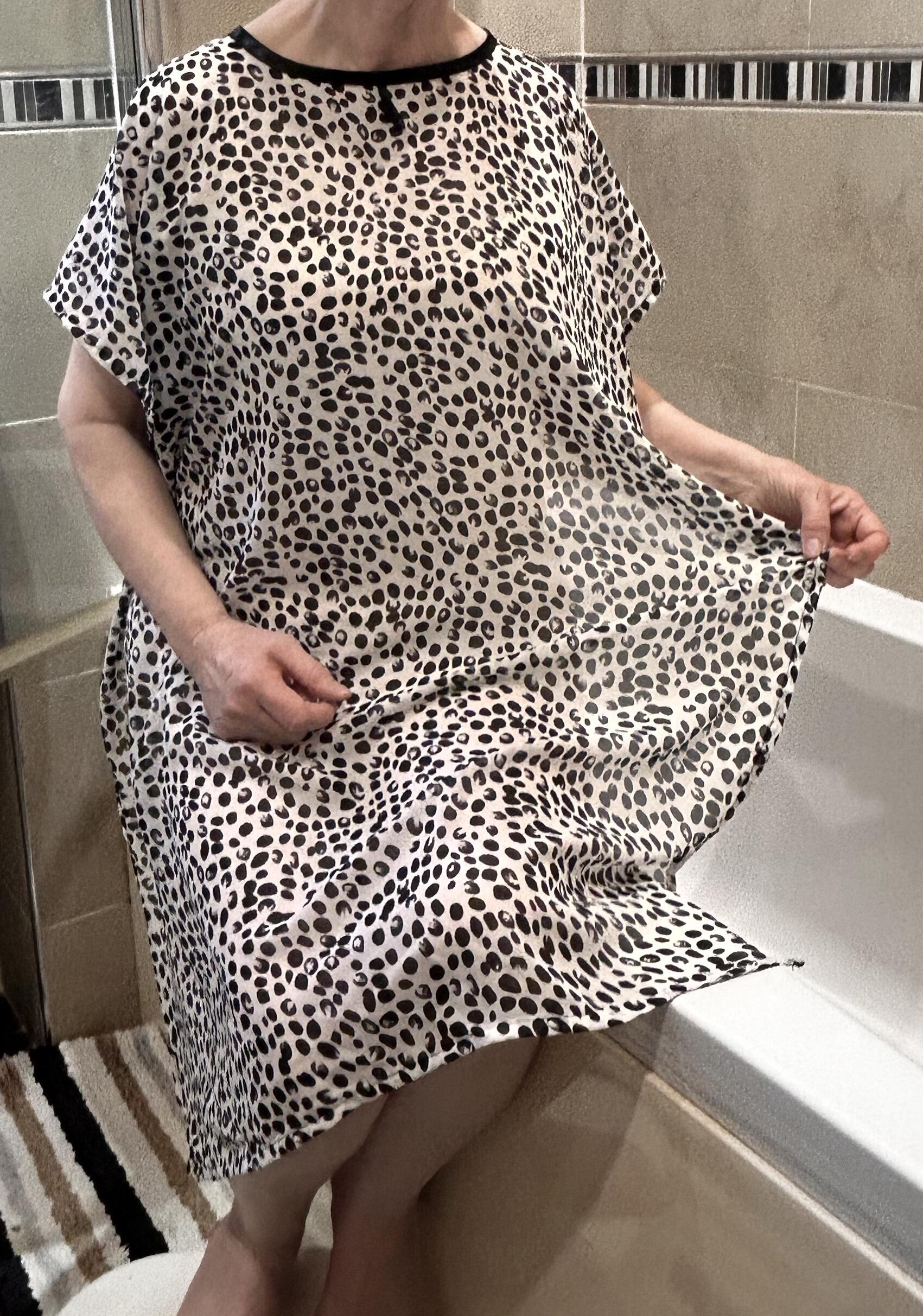 NeverNwkte(tm) Shower Attire to be worn inthe shower to maintain dignity and modesty