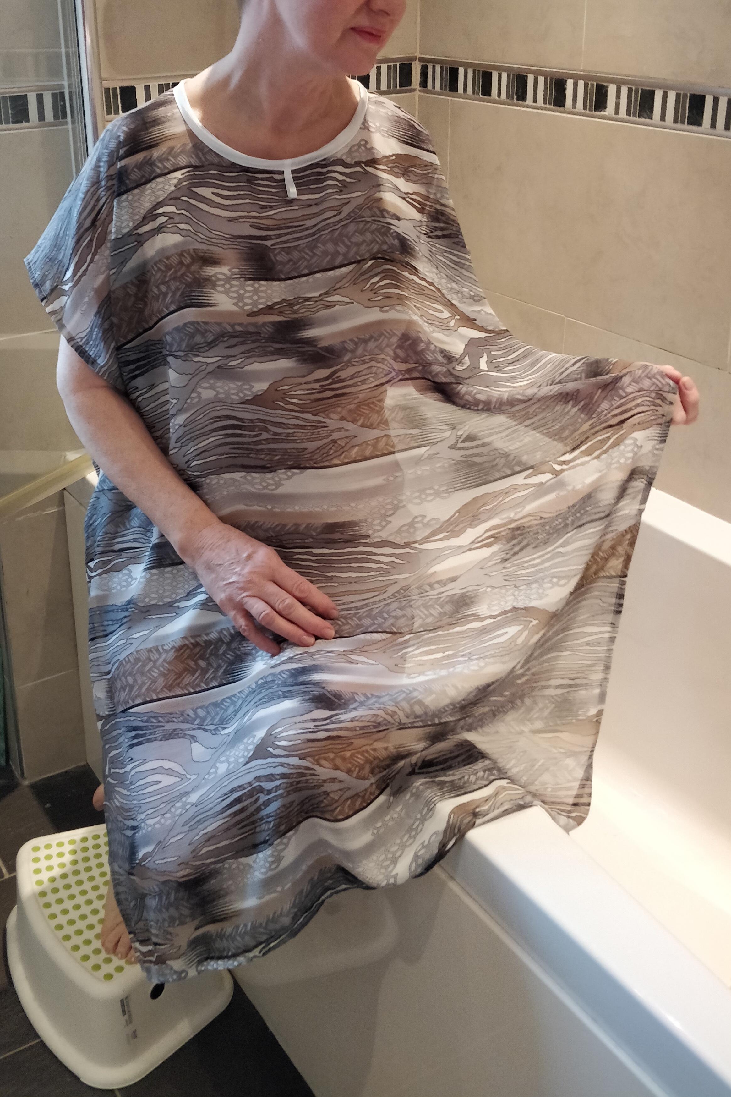 Grey/Beige abstract NeverNaked(tm) Shower Drapron® - dementia dignity showering cape drapes over shoulders to be left on whilst showering so dignity is maintained. No sleeves. Small magnetic fastening at back