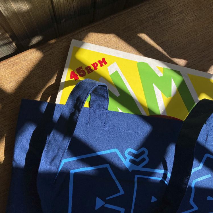 Crate Digger Tote Bag shown with Records