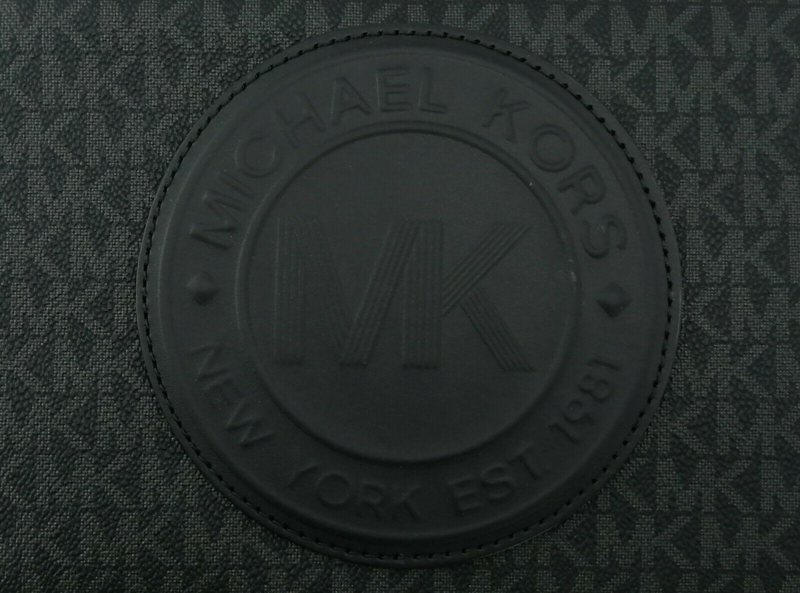 Michael Kors Black Crossbody Bag close up logo