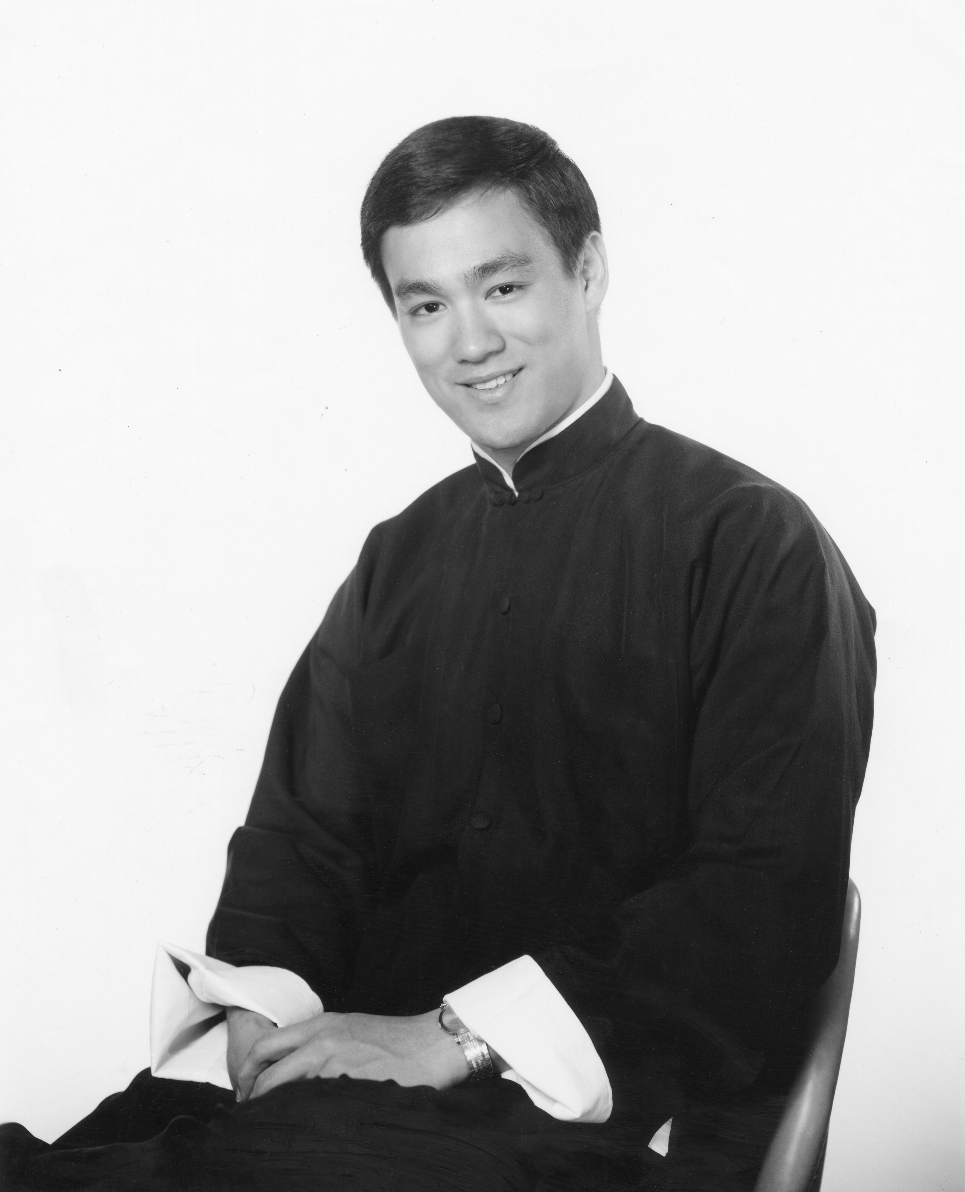 Black and white portrait photo of Bruce Lee