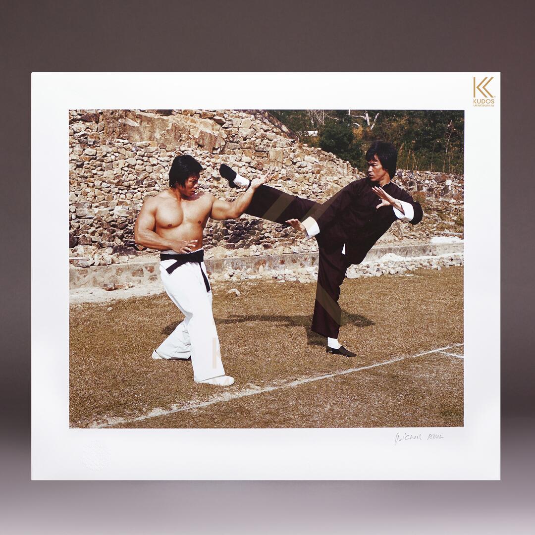 image of Bruce Lee from an Enter the Dragon off-set promotional photoshoot simulating a fight between Lee and Bolo, played by Yang Sze (now Bolo Yeung). 