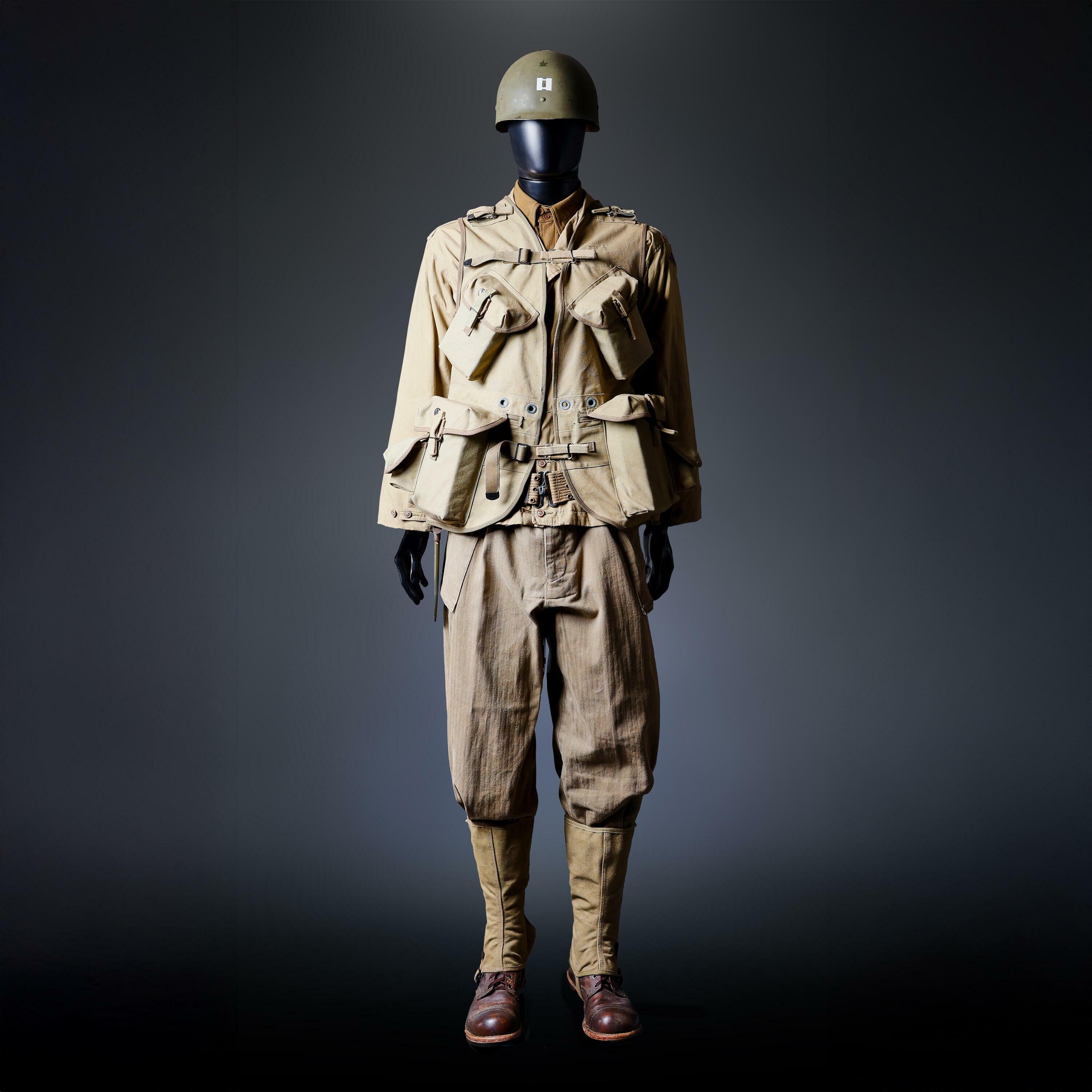 Captain Miller’s army ranger costume worn by Tom Hanks in Saving Private Ryan, displayed on a mannequin with full military gear.