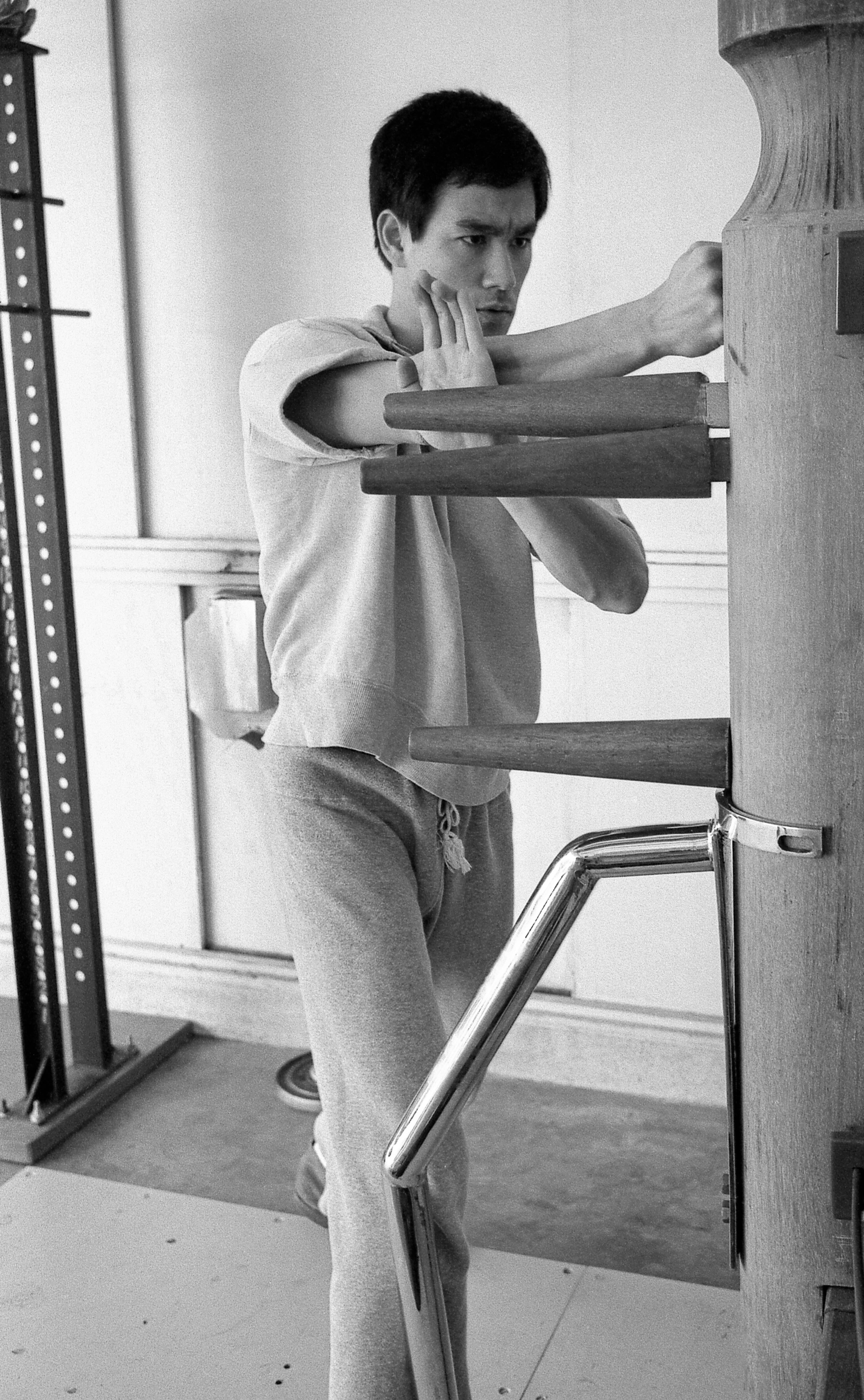 Bruce Lee training on a Wing Chun Wooden Dummy