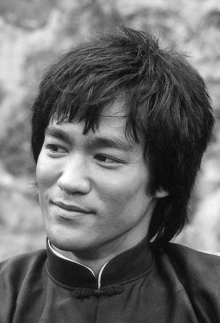 Close up black and white headshot of Bruce Lee