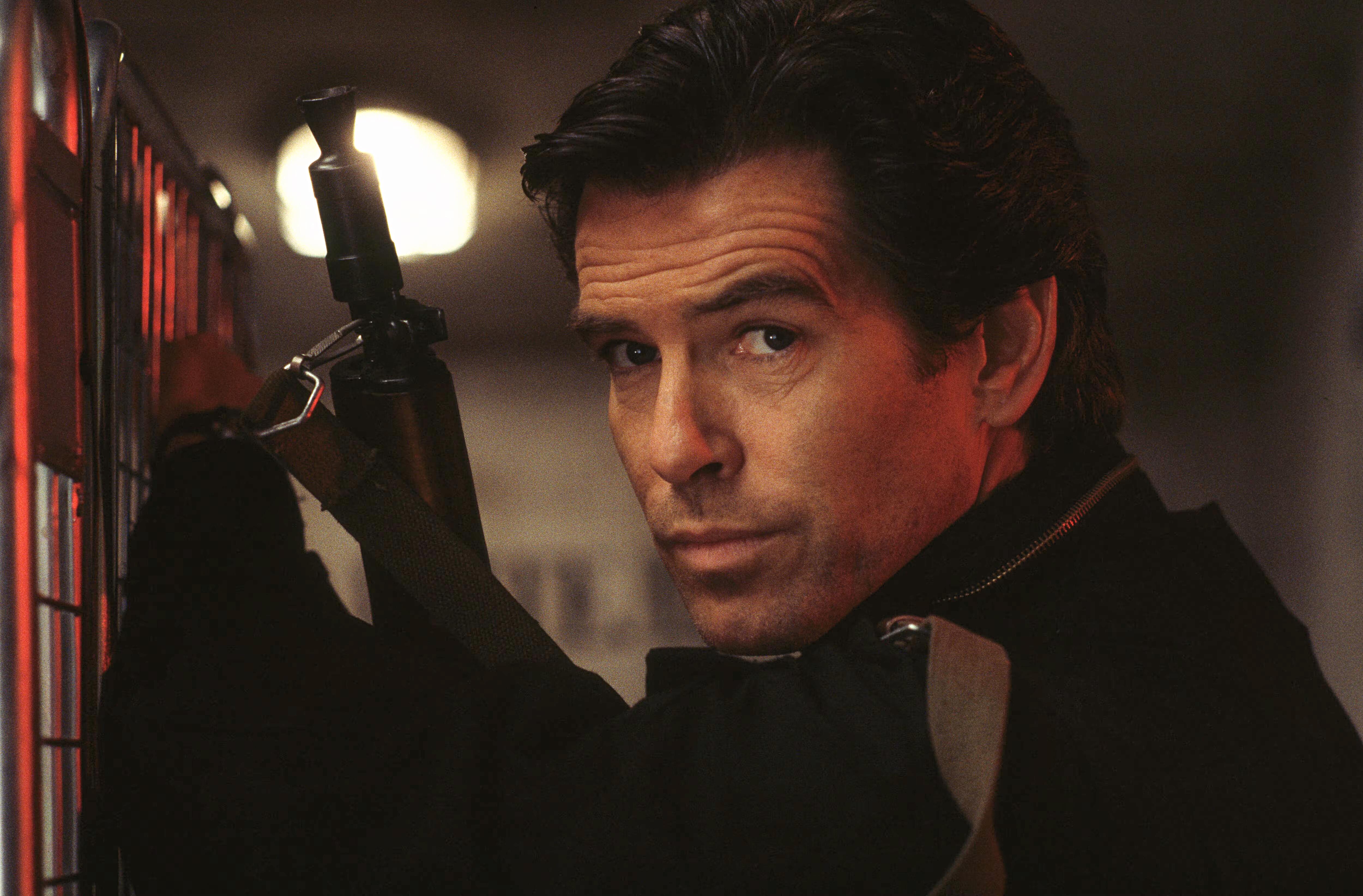 Pierce Brosnan as James Bond posing for a publicity shot for Goldeneye (1995)