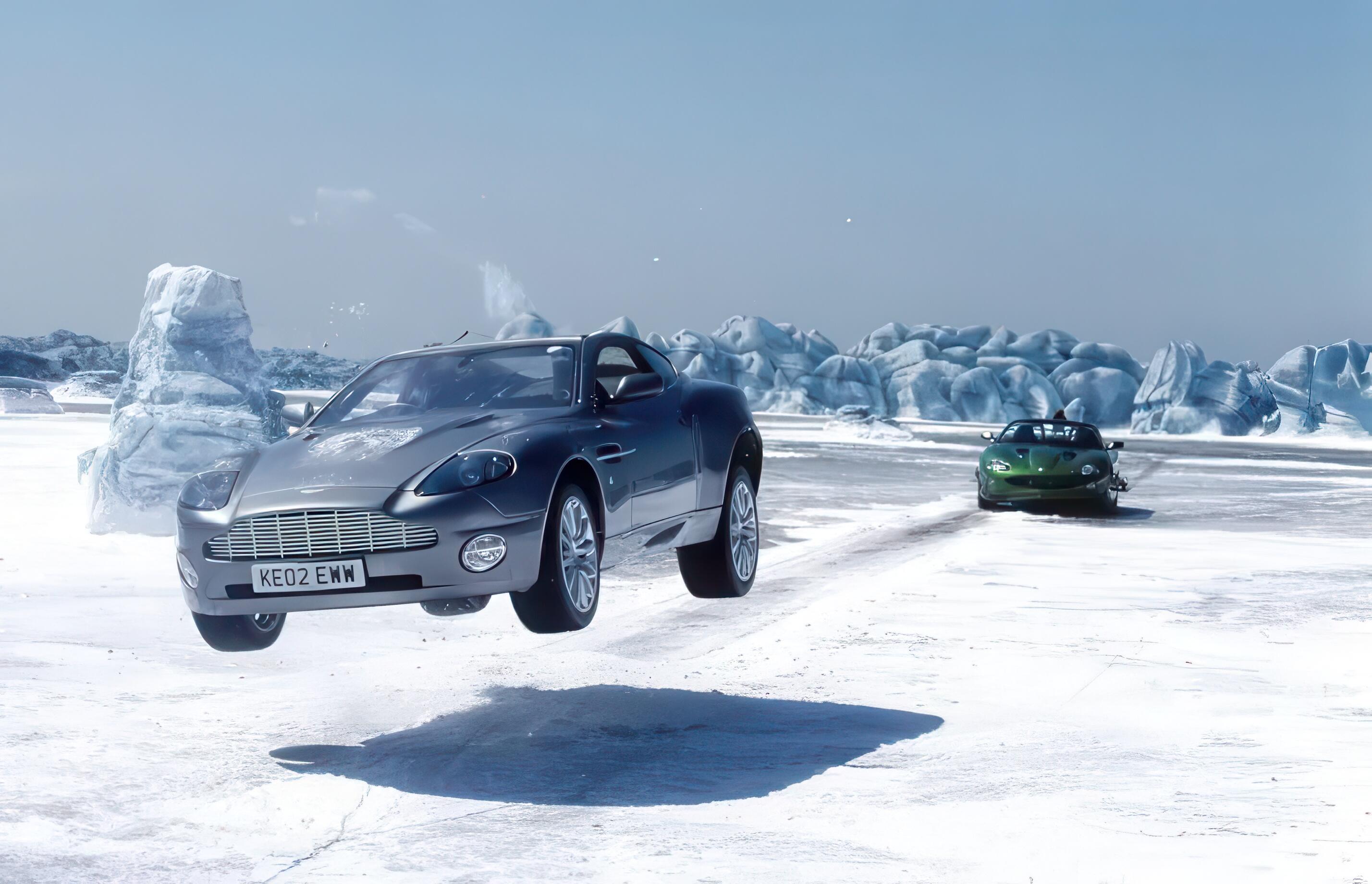 James Bond (Pierce Brosnan) in his Aston Martin Vanquish pursued across a frozen lake by villainous henchman, Rick Yune, in his Jaguar XKR for Die Another Day (2002)