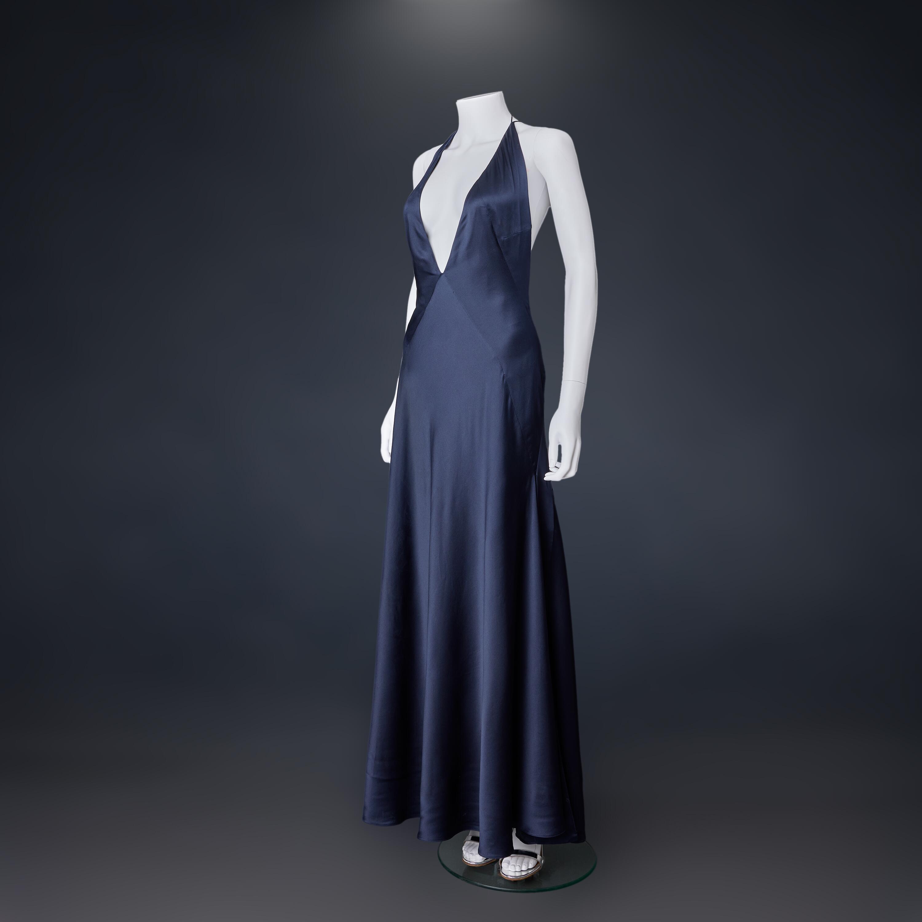 Ana de Armas's screen-used Paloma dress and sandals from the Cuba SPECTRE party scene in No Time to Die. Comes complete with certification from EON Archive Director Meg Simmonds