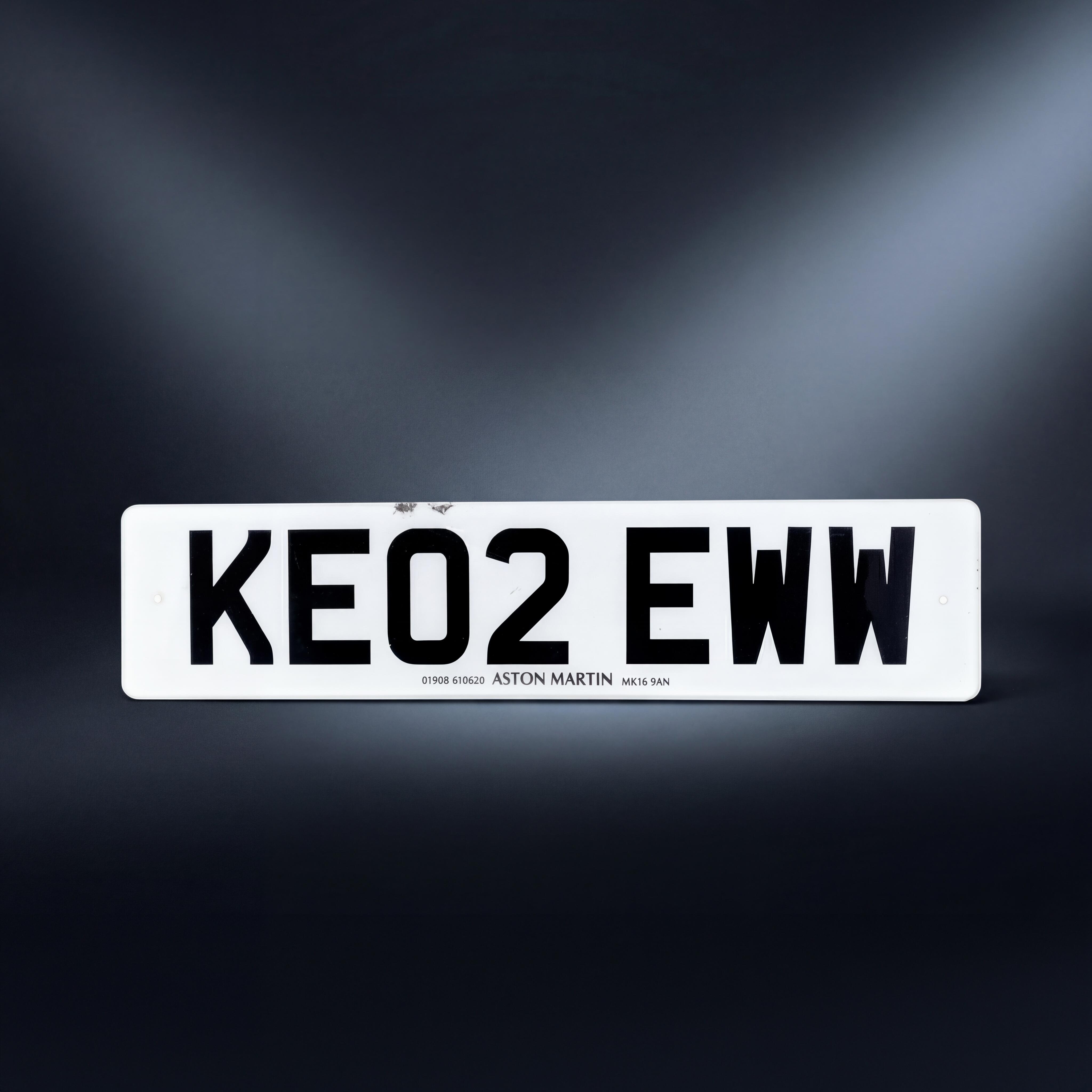 A production-used KE02 EWW Aston Martin V12 Vanquish license plate from the James Bond film Die Another Day.