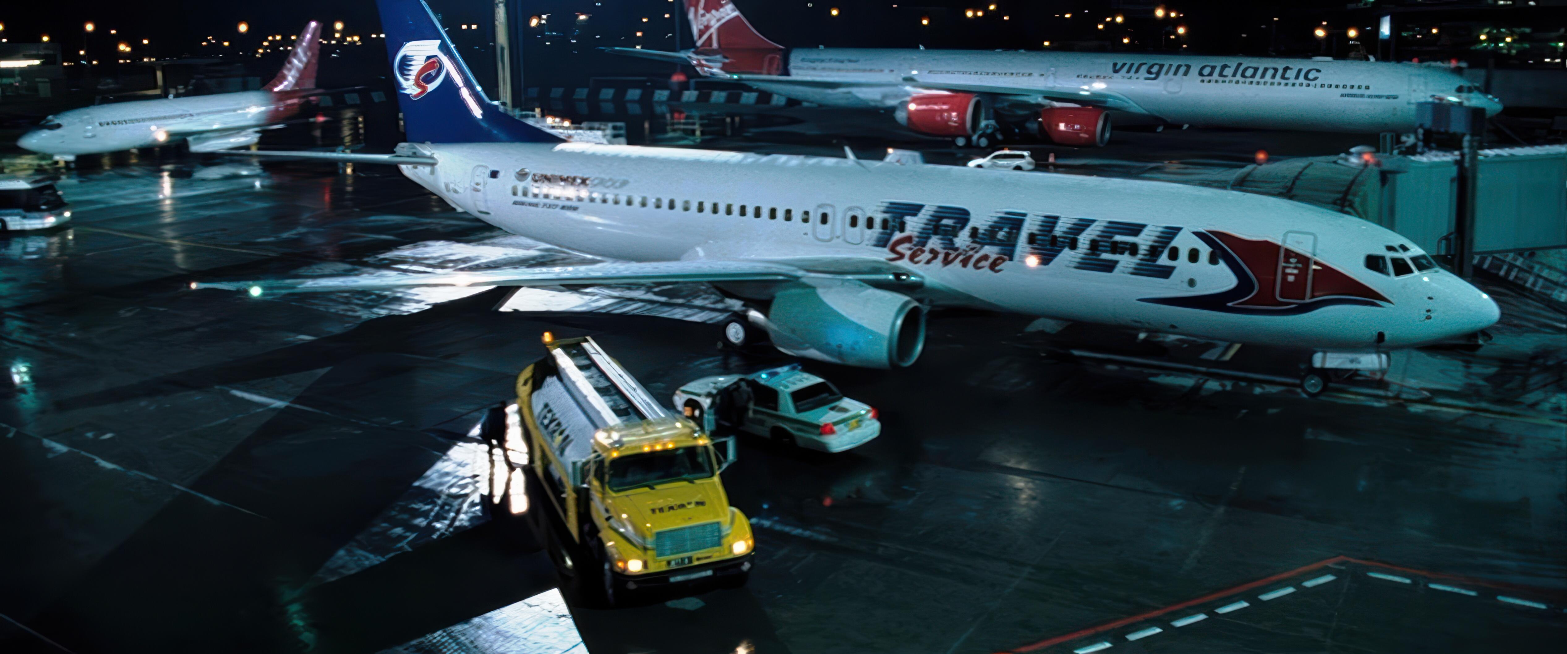 The high-stakes Miami International Airport chase scene from Casino Royale, featuring a fuel truck on the wet tarmac at night.