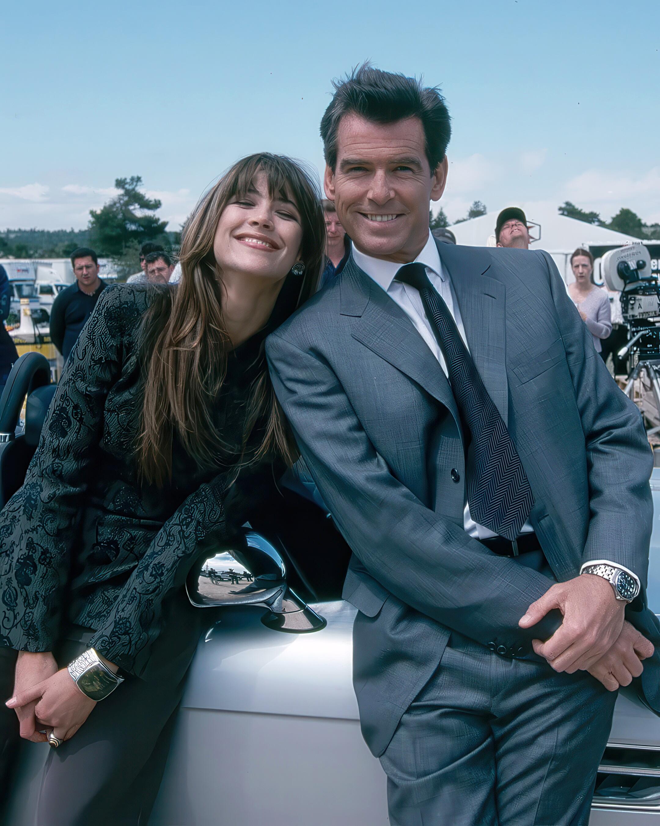 Pierce Brosnan (James Bond, 007) and co-star, Sophie Marceau behind the scenes for The World is Not Enough, 1999