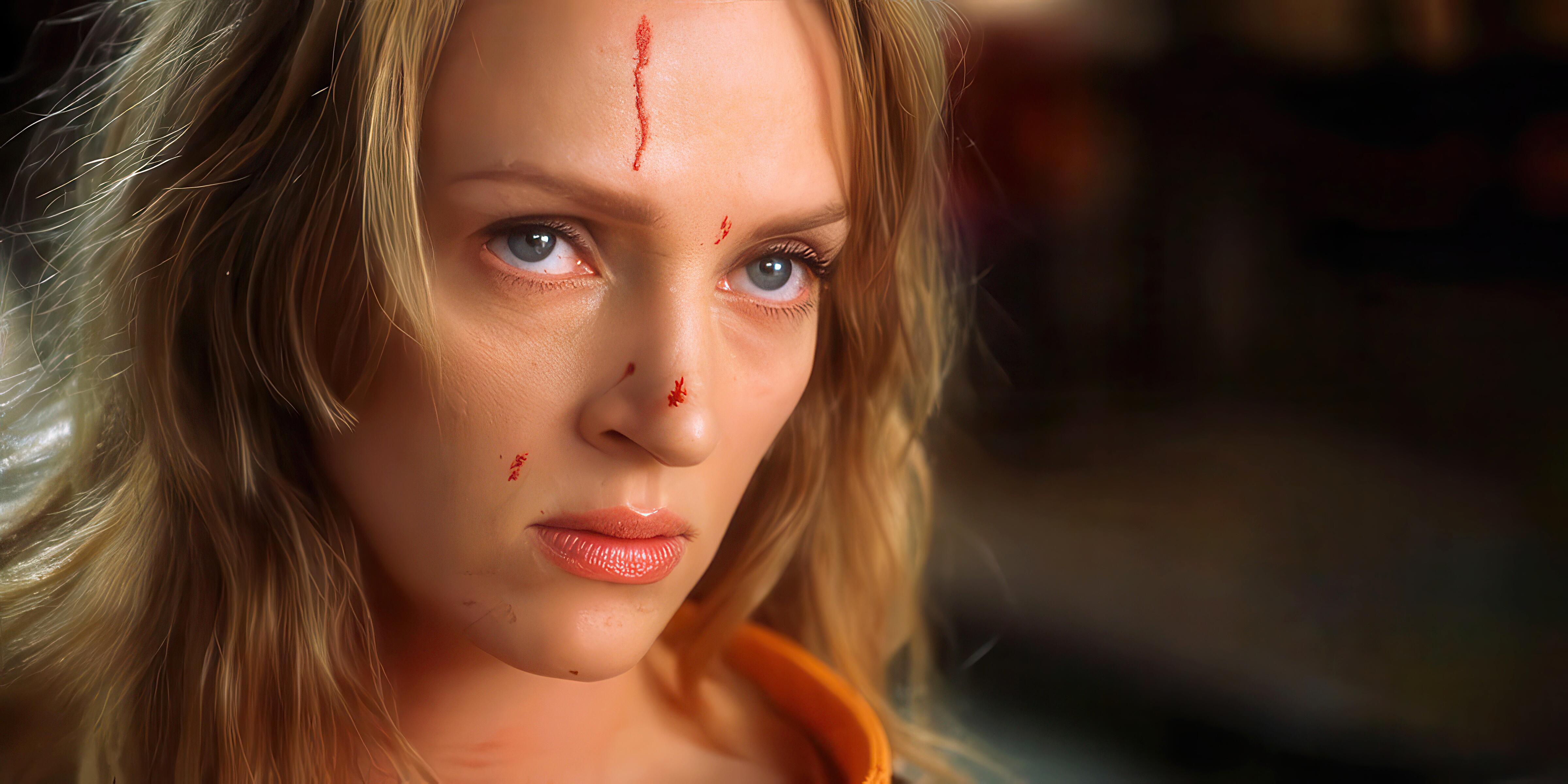 A close-up image of actress, Uma Thurman, with blood splatters on her face from the main fight sequence in Quentin Tarantino’s Kill Bill (2003).