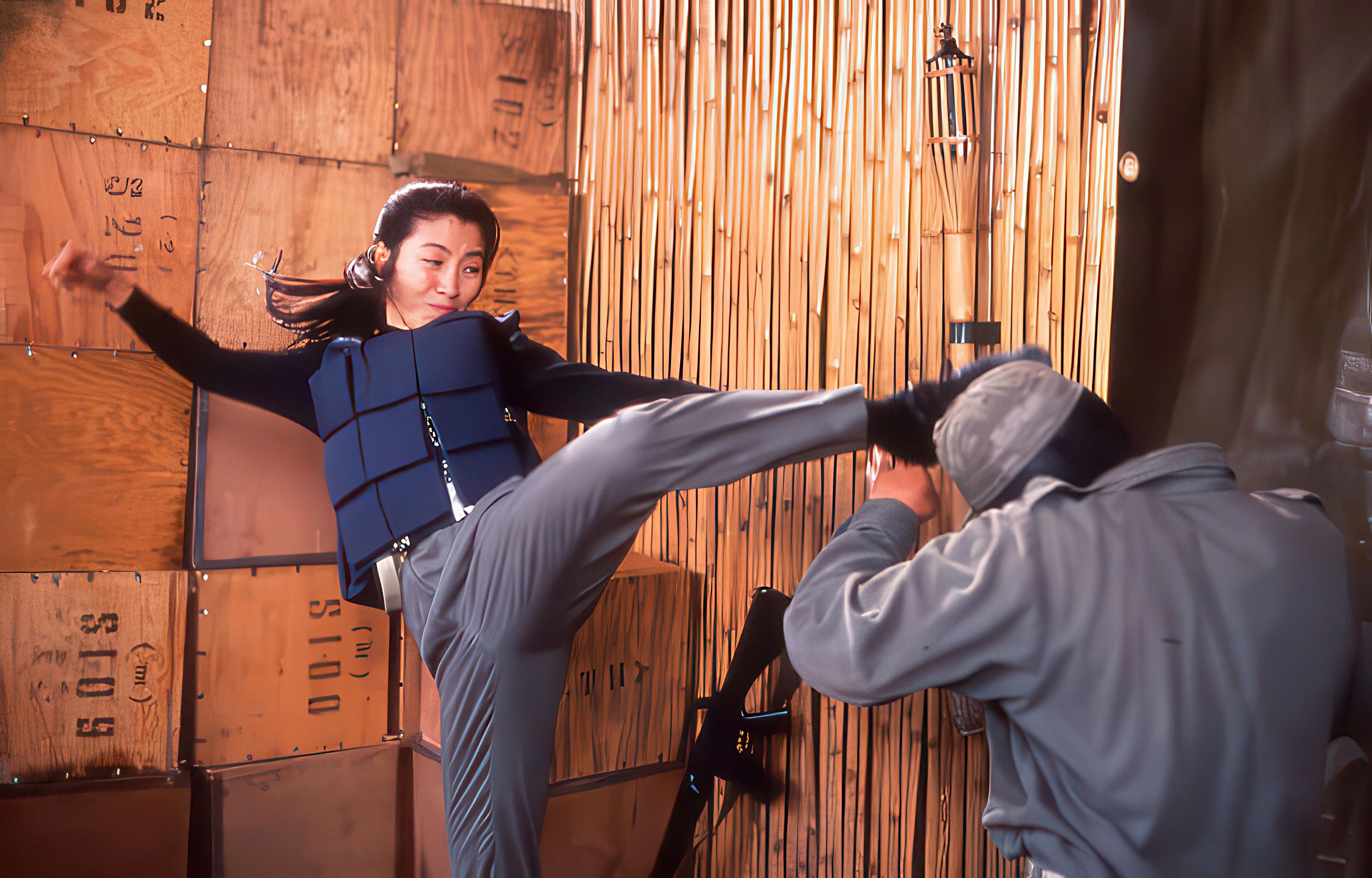 Michelle Yeoh, martial arts superstar and Academy Award winner, performing a roundhouse kick to the head of an assailant in Jackie Chan’s Police Story 3 (Supercop, 1992), directed by Stanley Tong.