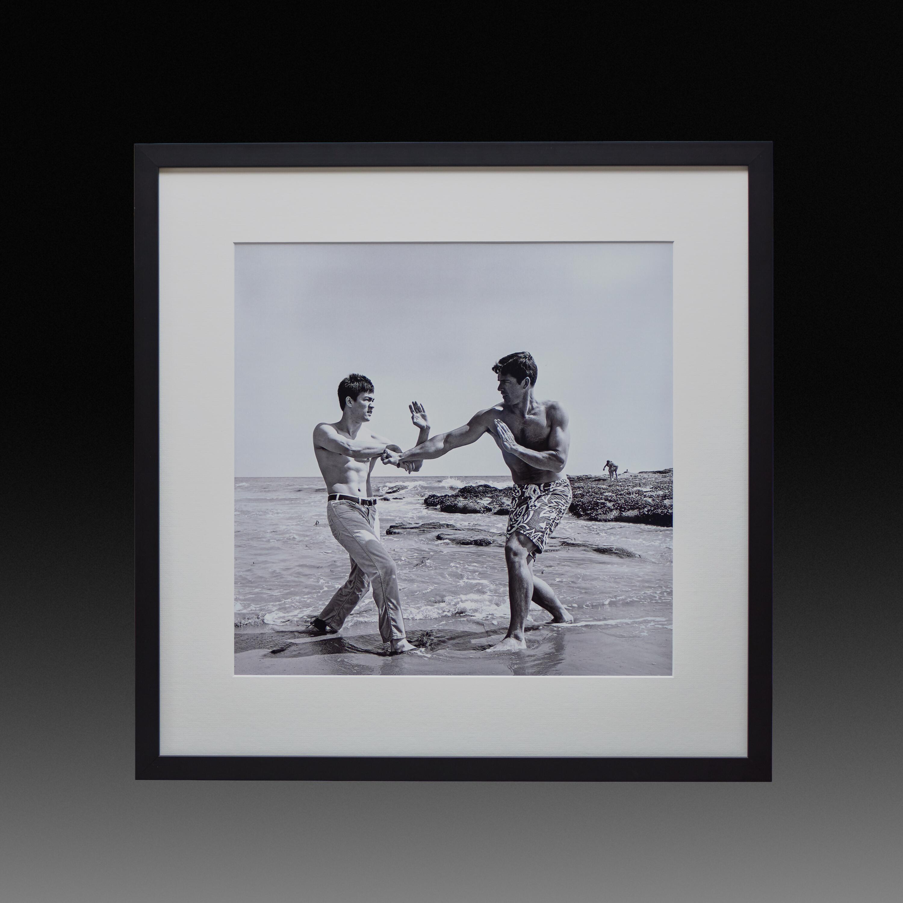 Framed 21.5-inch exhibition print of Bruce Lee playfully sparring with Van Williams for The Green Hornet publicity campaign.