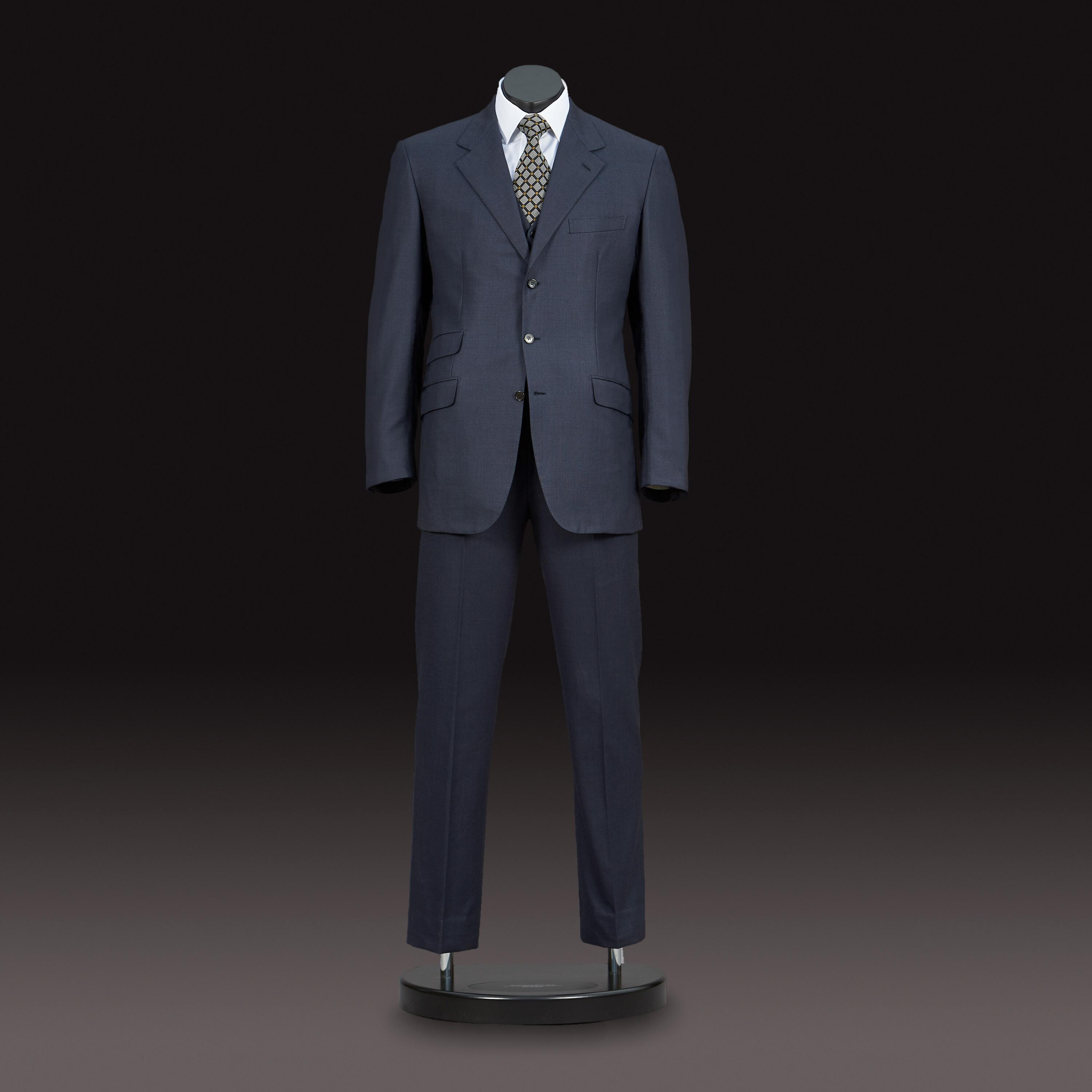 A signature Brioni Suit worn by Pierce Brosnan as 007 in ‘Goldeneye’, the seventeenth feature in the James Bond franchise - curated by Kudos Memorabilia Ltd
