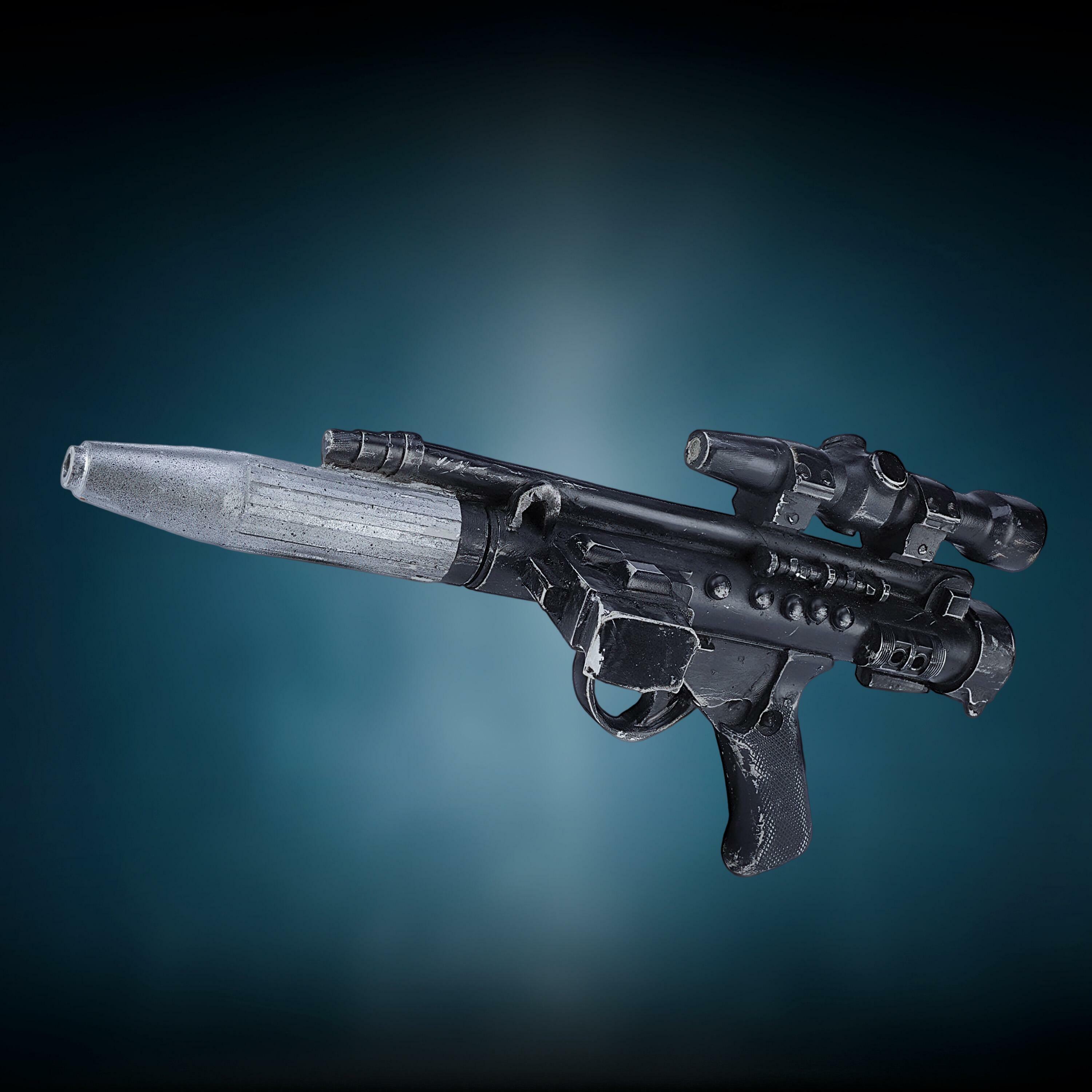 Production-made Rebel Trooper DH-17 blaster pistol from Star Wars: The Empire Strikes Back, shown against a gradient blue background.