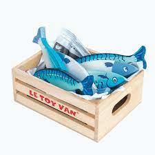 A wooden box brimming with vibrant toy fish, part of the Le Toy Van fish market set.
