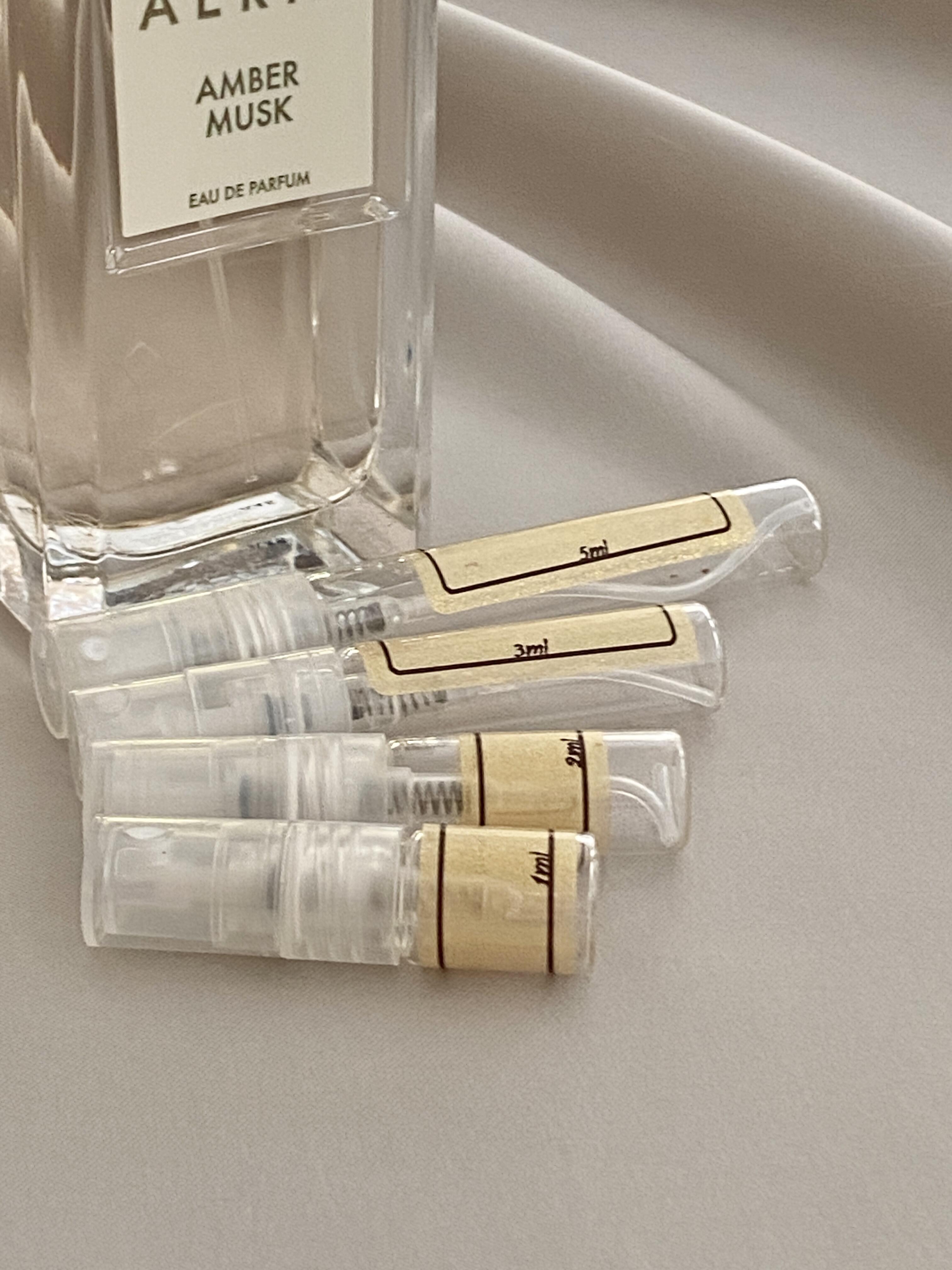 AERIN Amber Musk and sample bottles