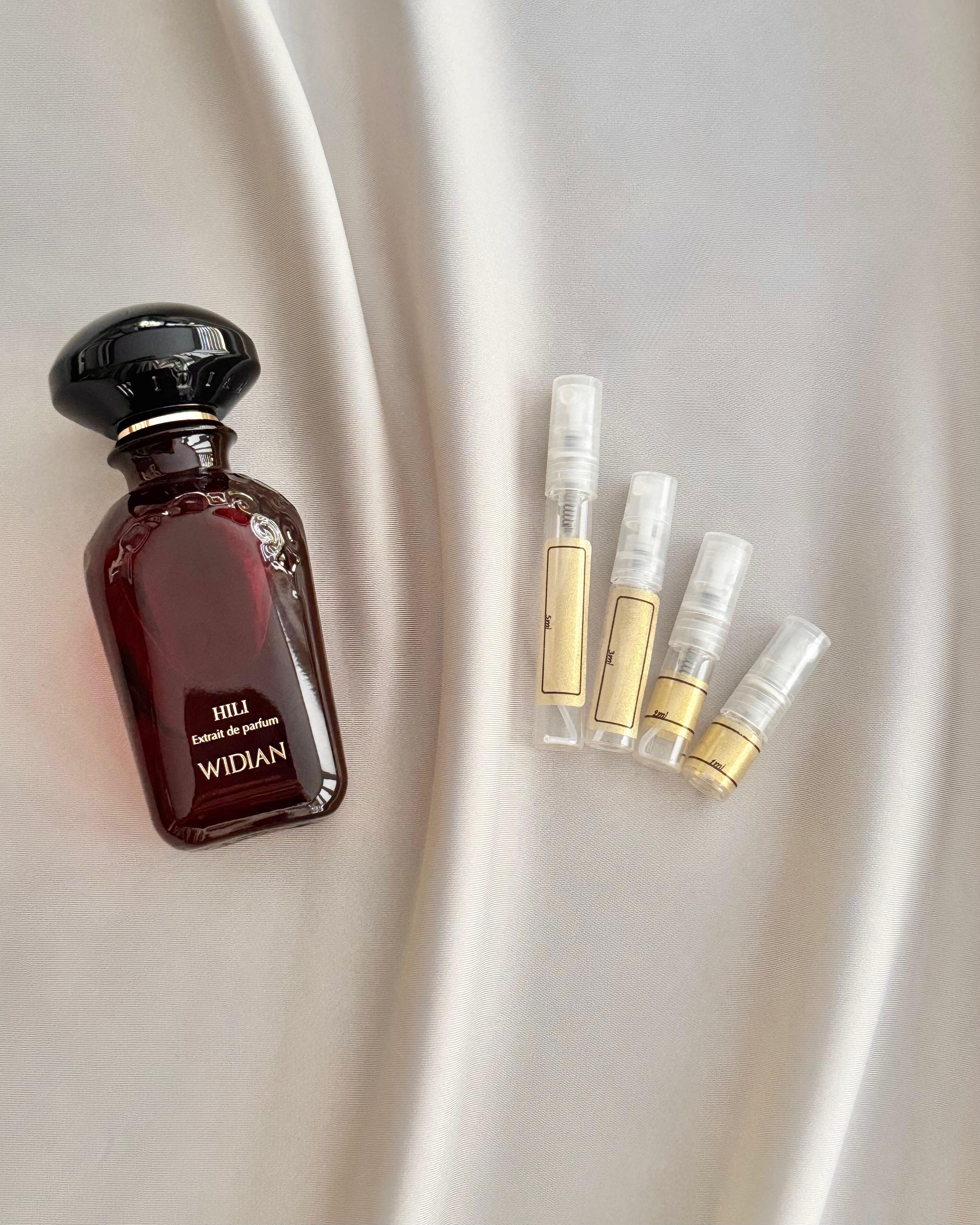 Widian Hili with sample bottles