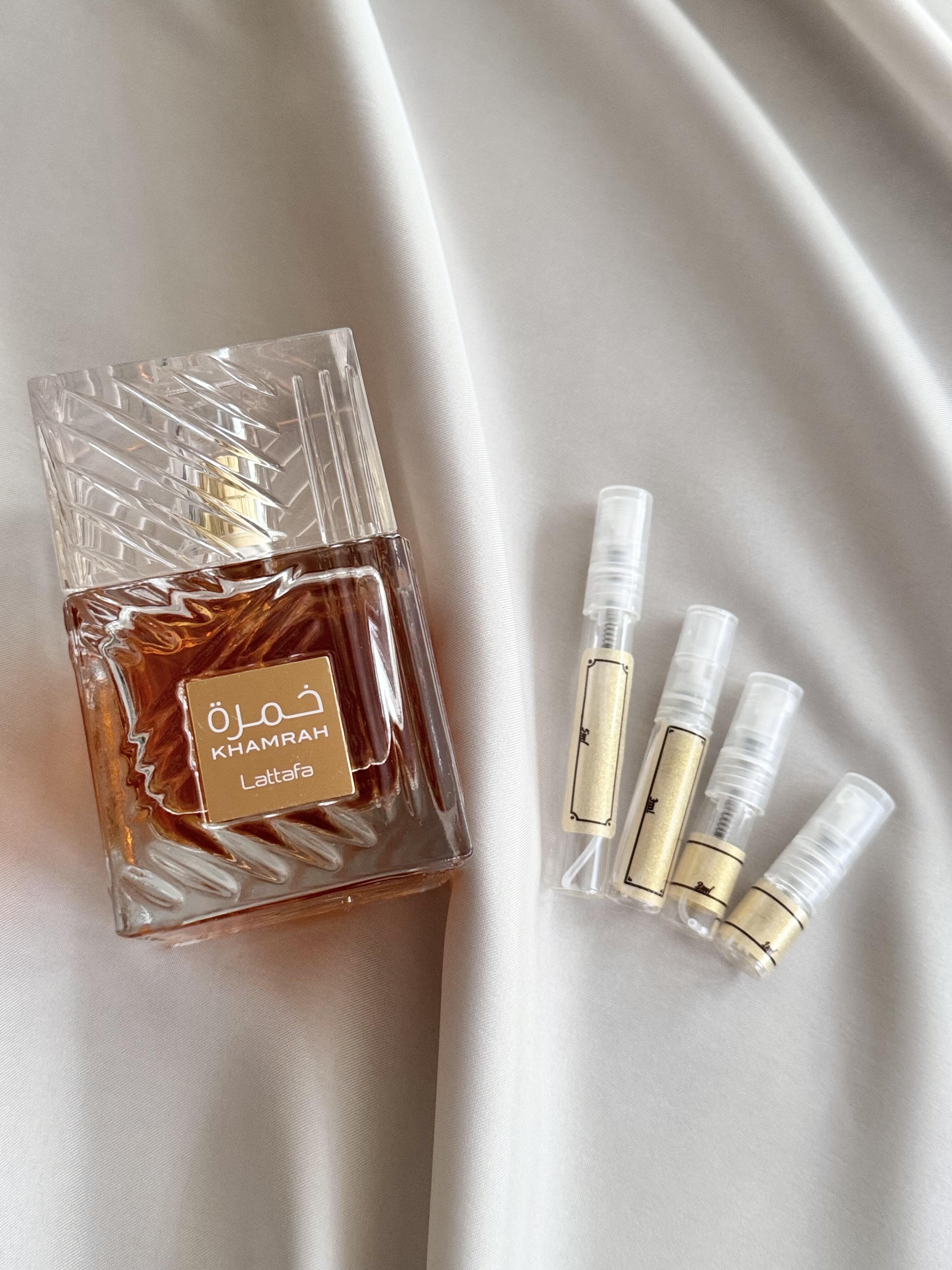 Lattafa Khamrah perfume bottle with samples