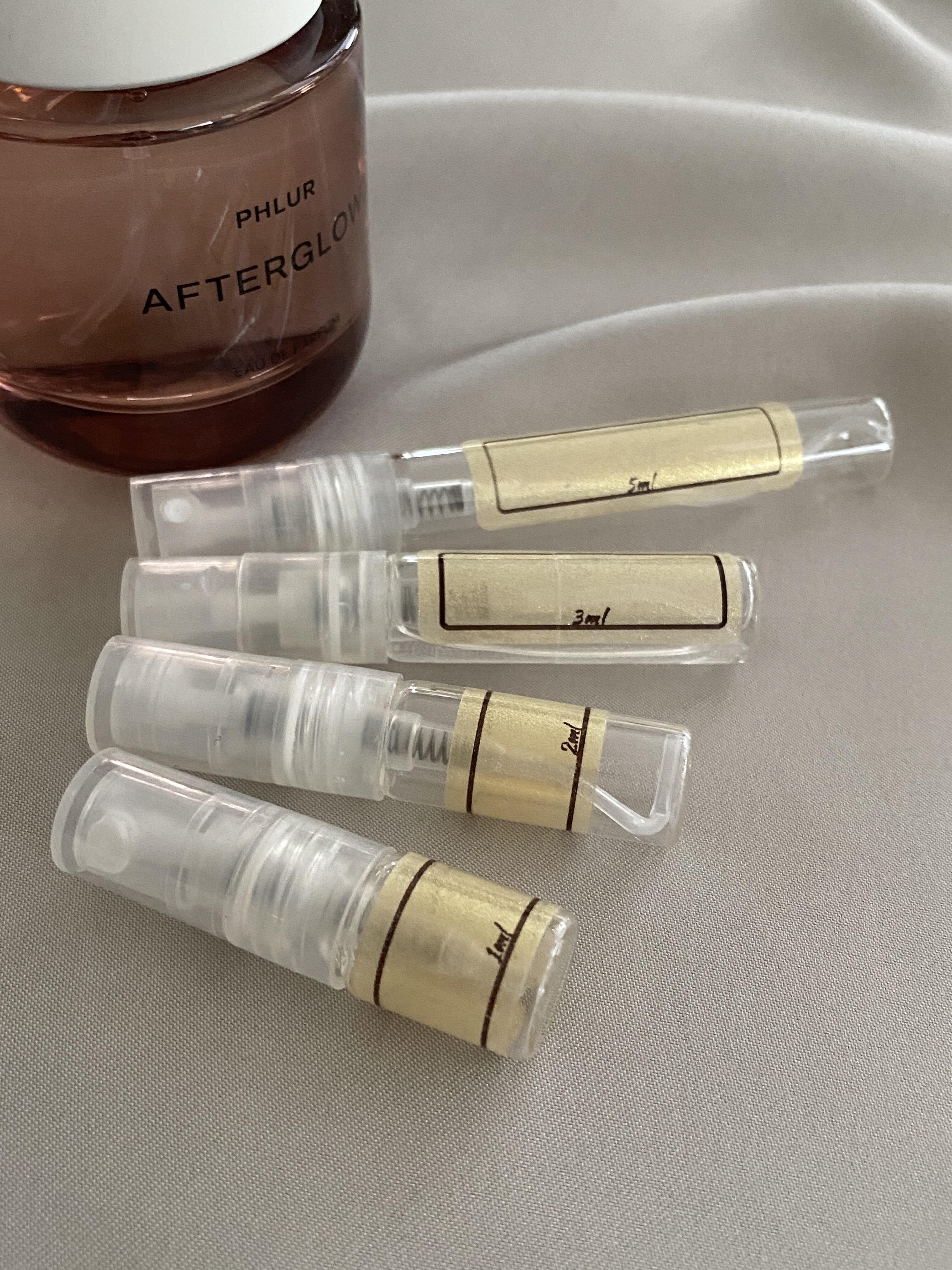 Phlur Afterglow and sample bottles