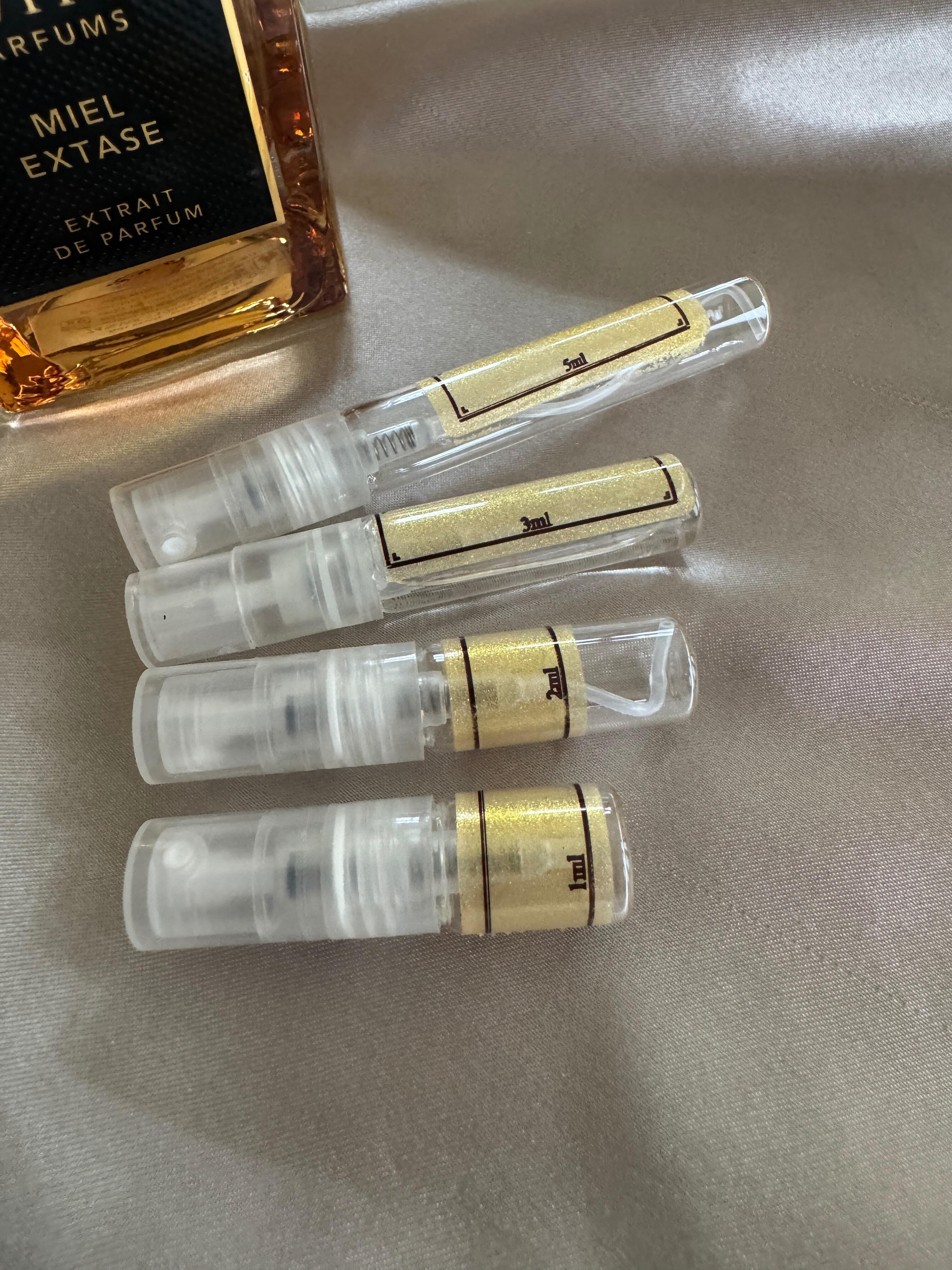 Navitus Parfums Miel Extase perfume bottle with samples