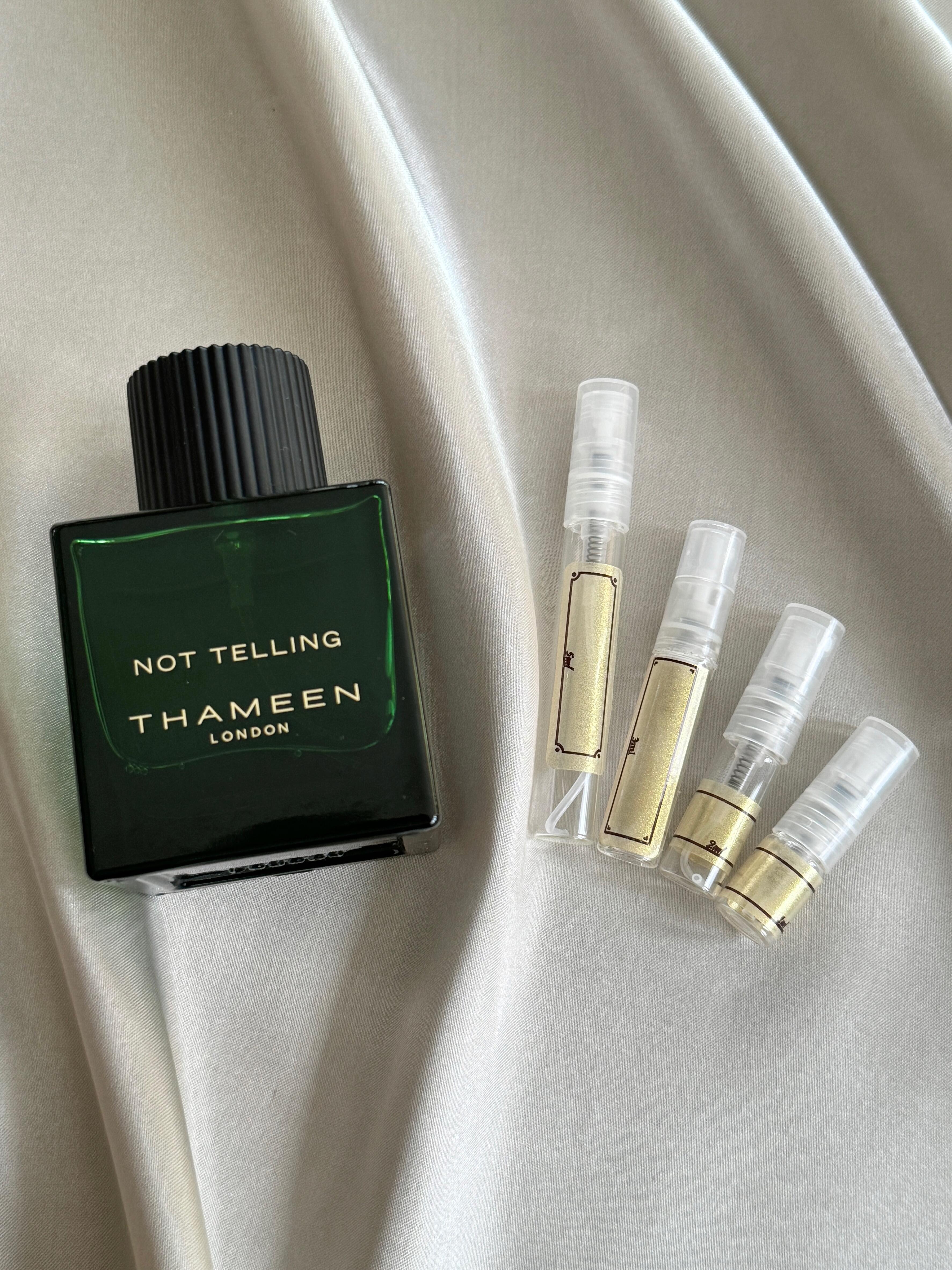 Thameen Not Telling perfume with sample bottles