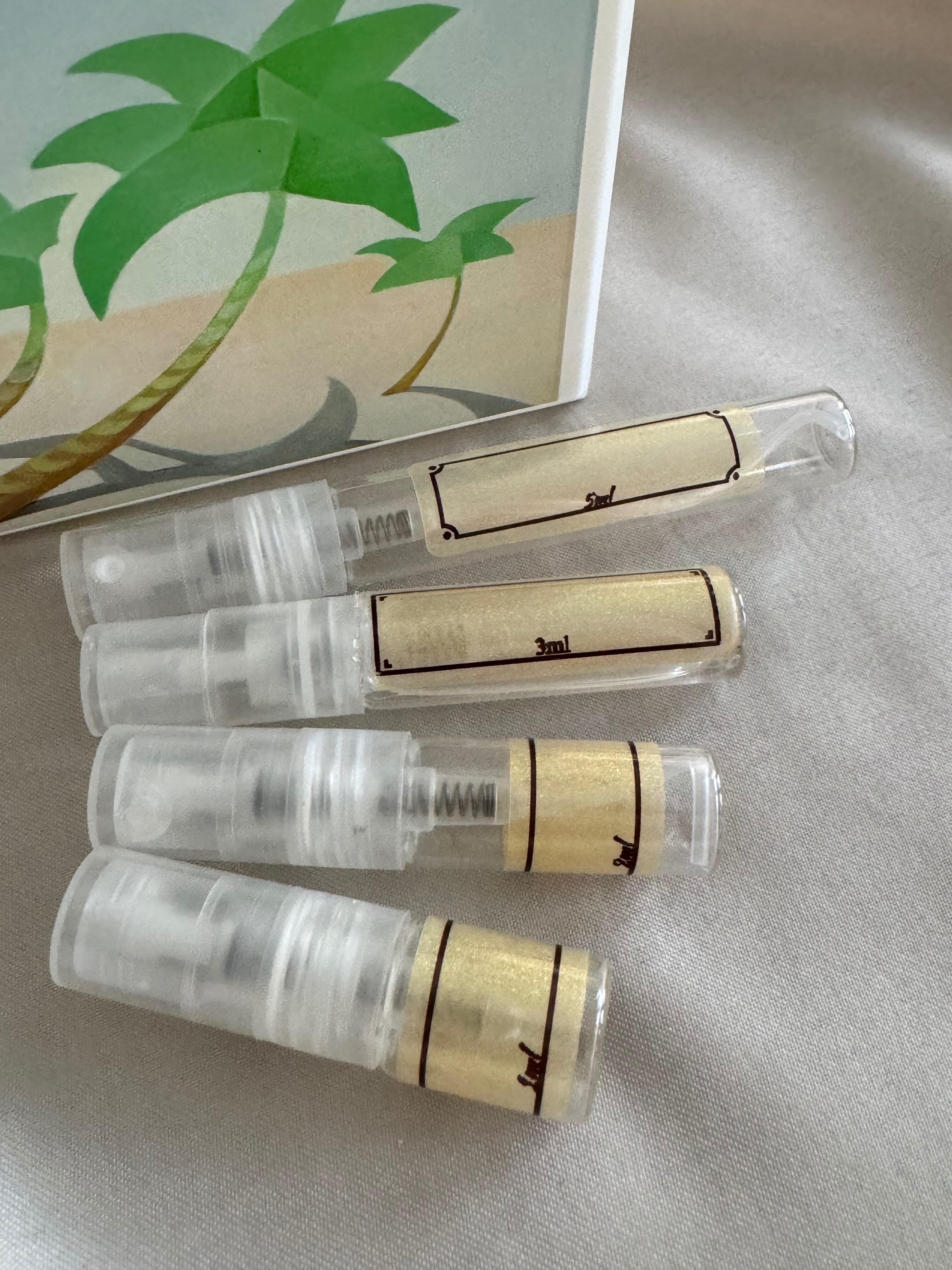 Adamo Parfum Juanillo perfume with sample bottles