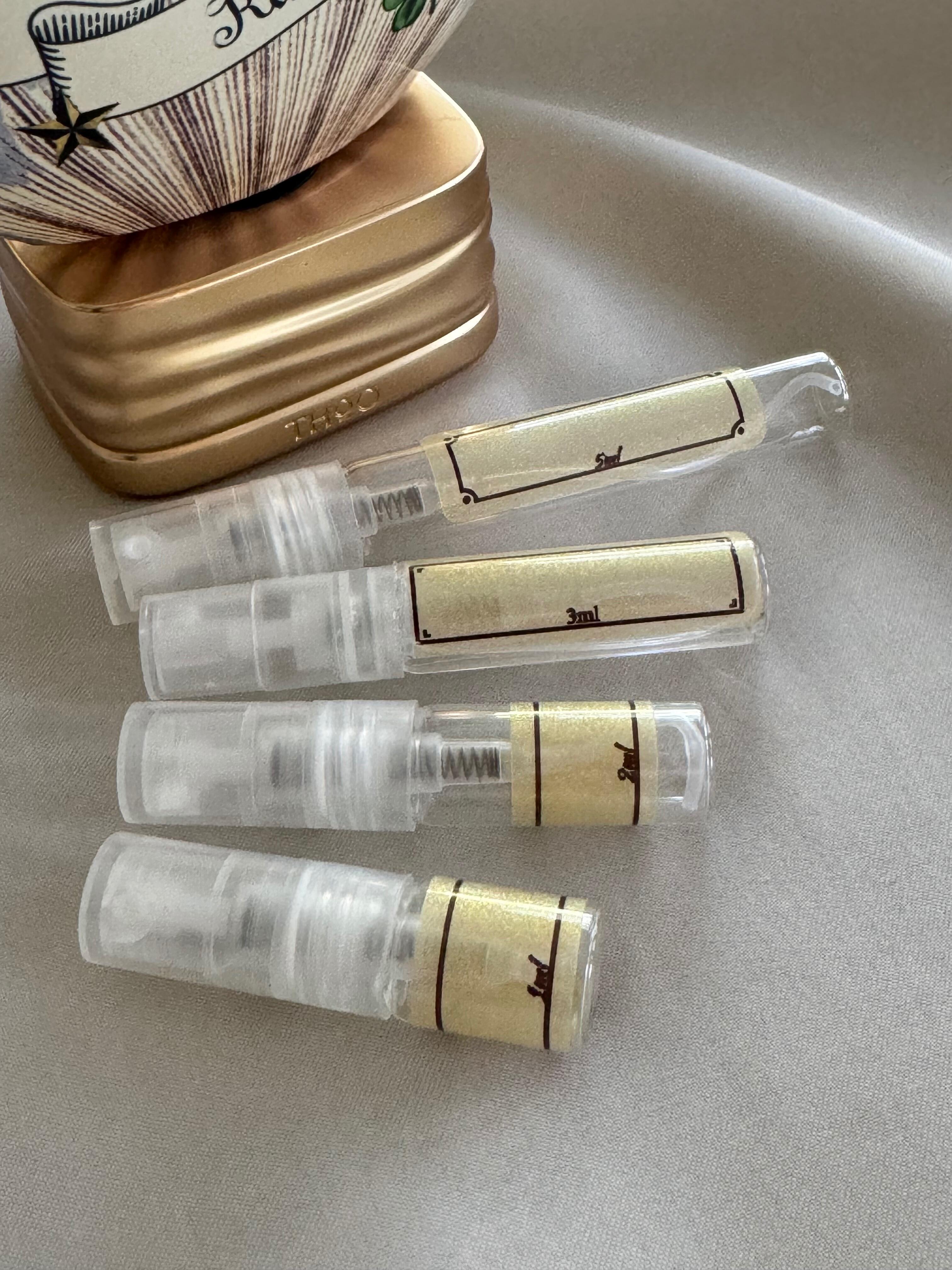 The House of Oud Dear Karma perfume with sample bottles